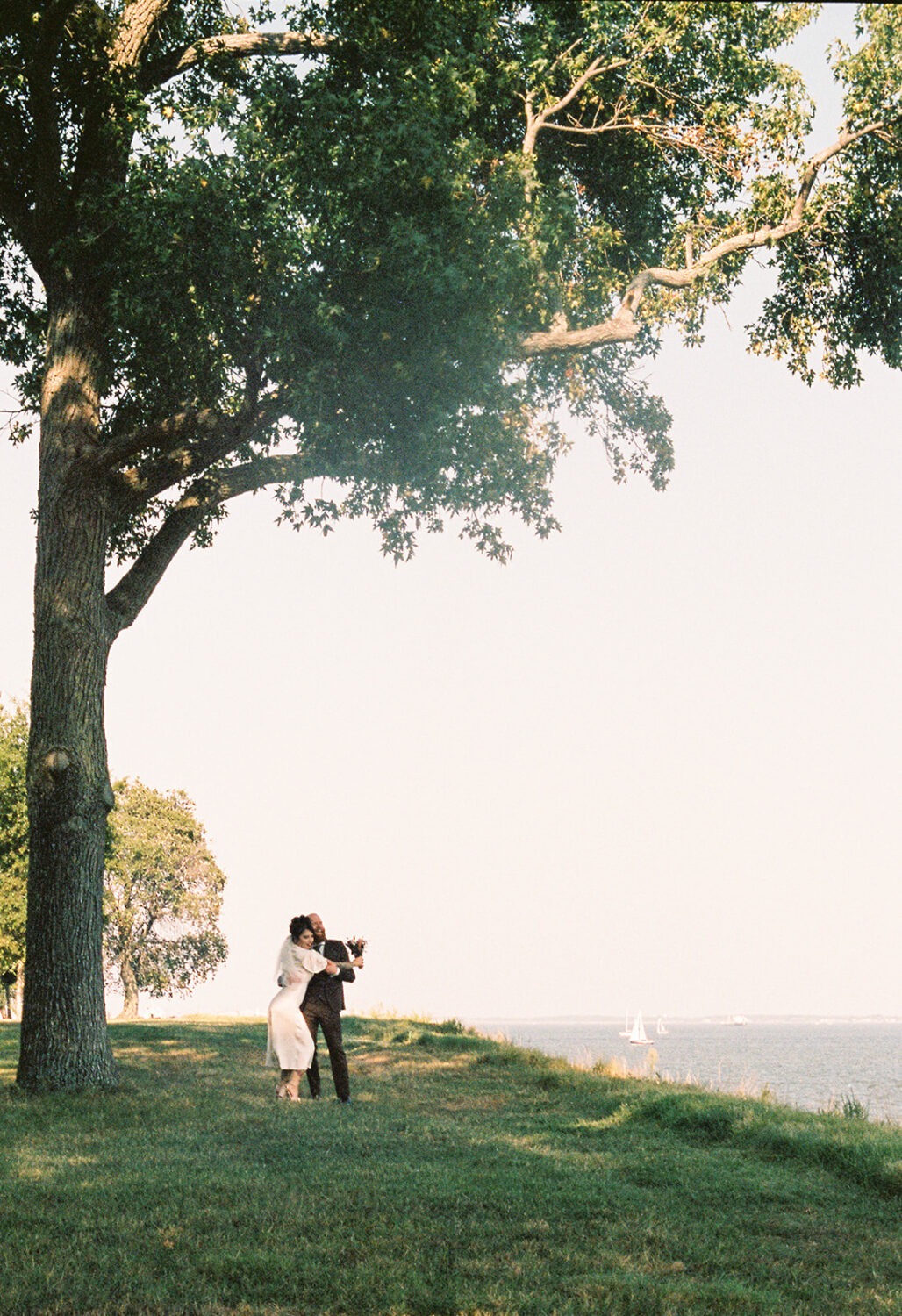 couple embraces at backyard wedding venue 