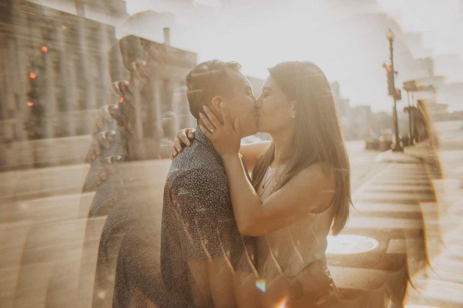couple kisses during sunrise engagement session