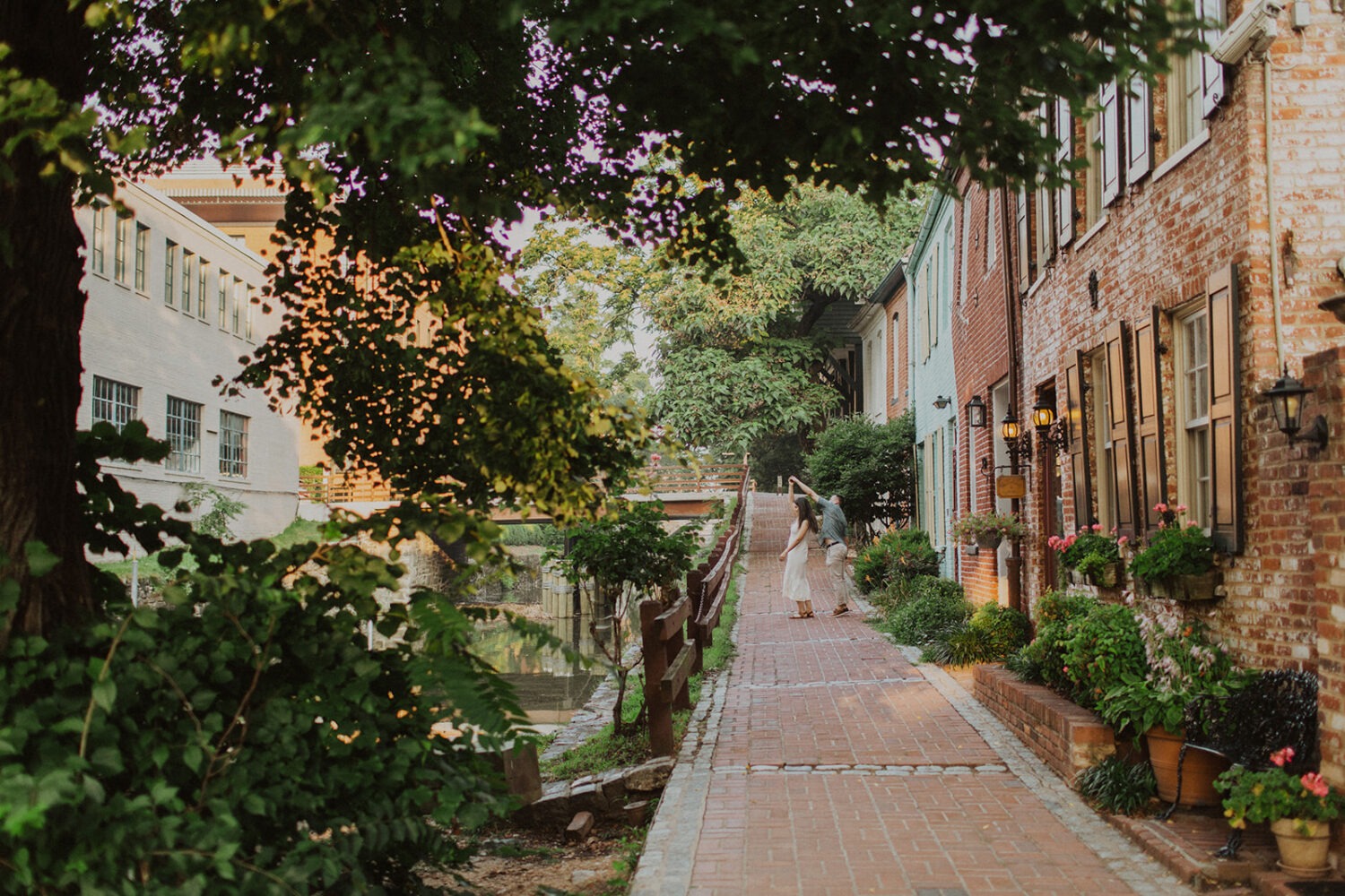couple twirls during Georgetown engagement shoot photos
