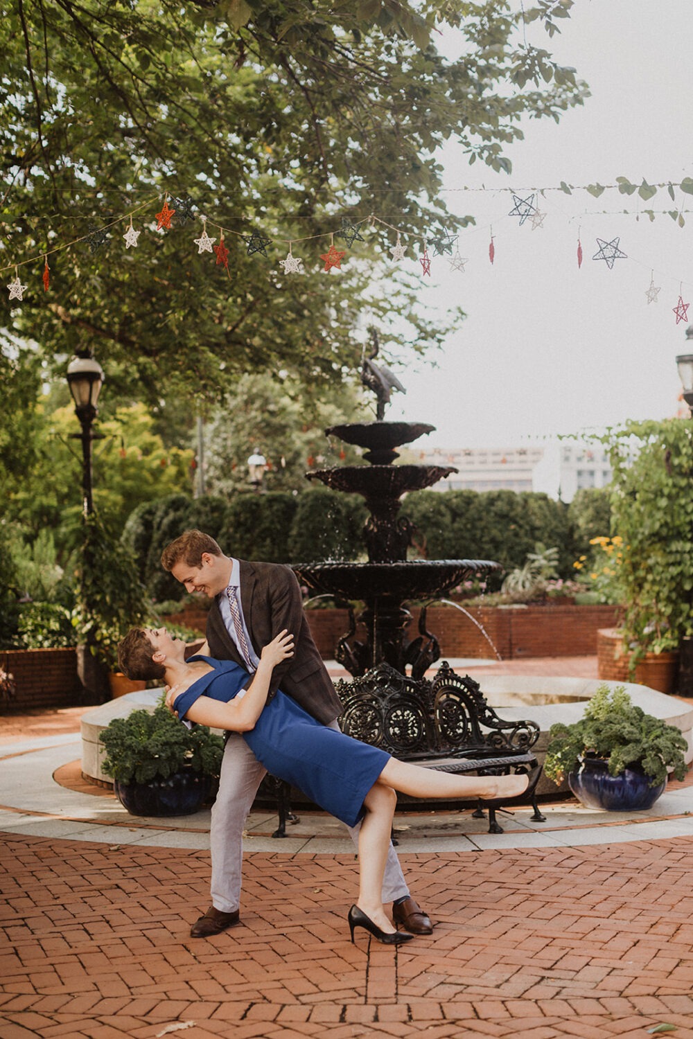 couple poses at Smithsonian castle garden