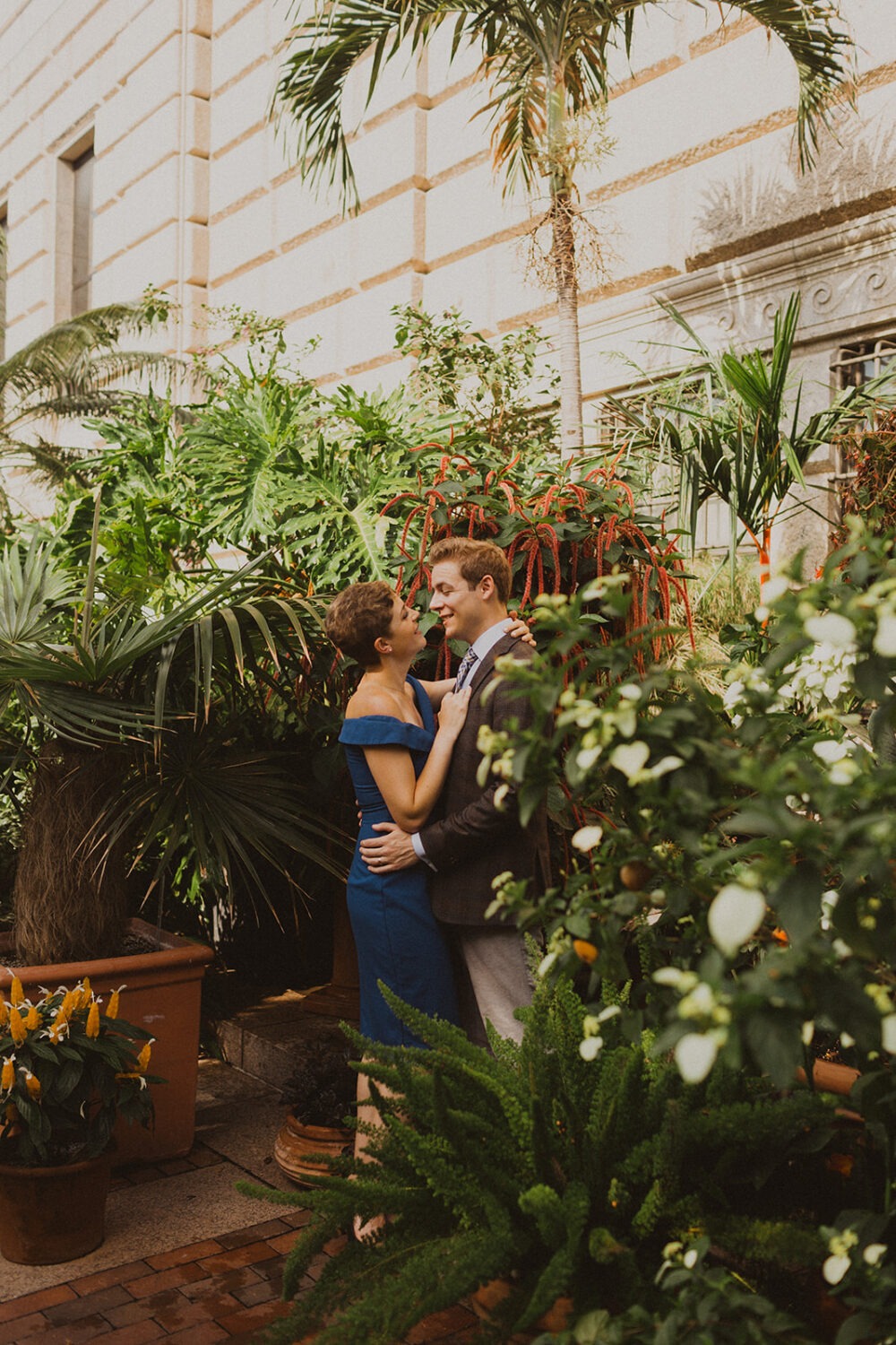 couple embraces at Smithsonian castle garden