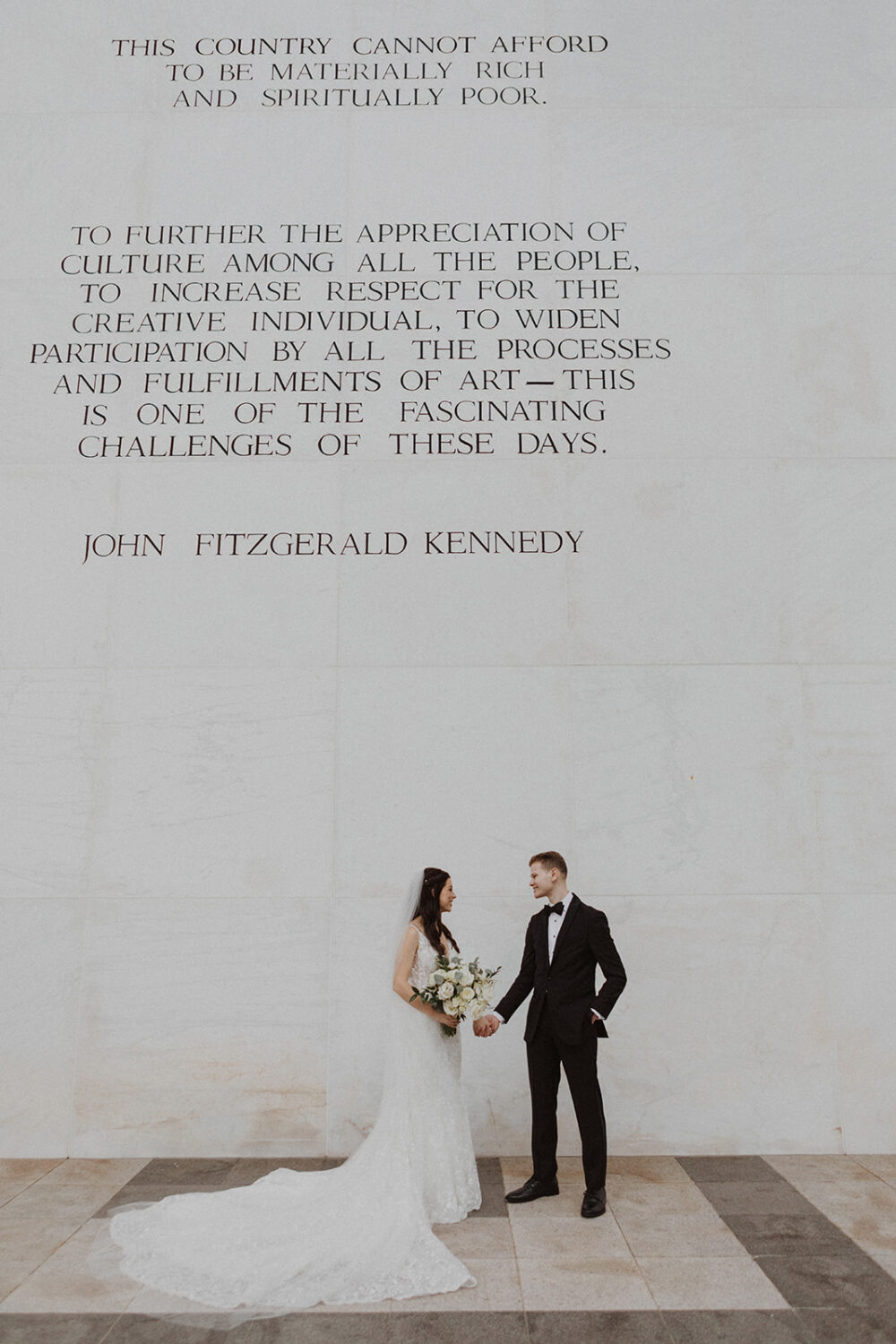 couple holds hands at Washington DC Kennedy Center elopement