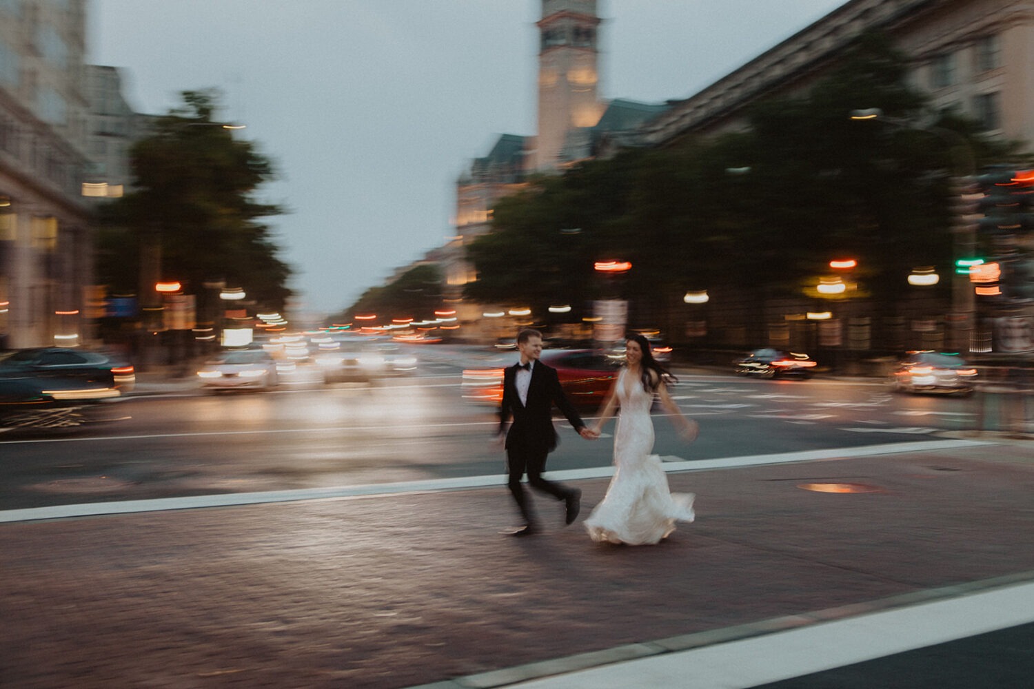 couple runs across street at Washington DC elopement