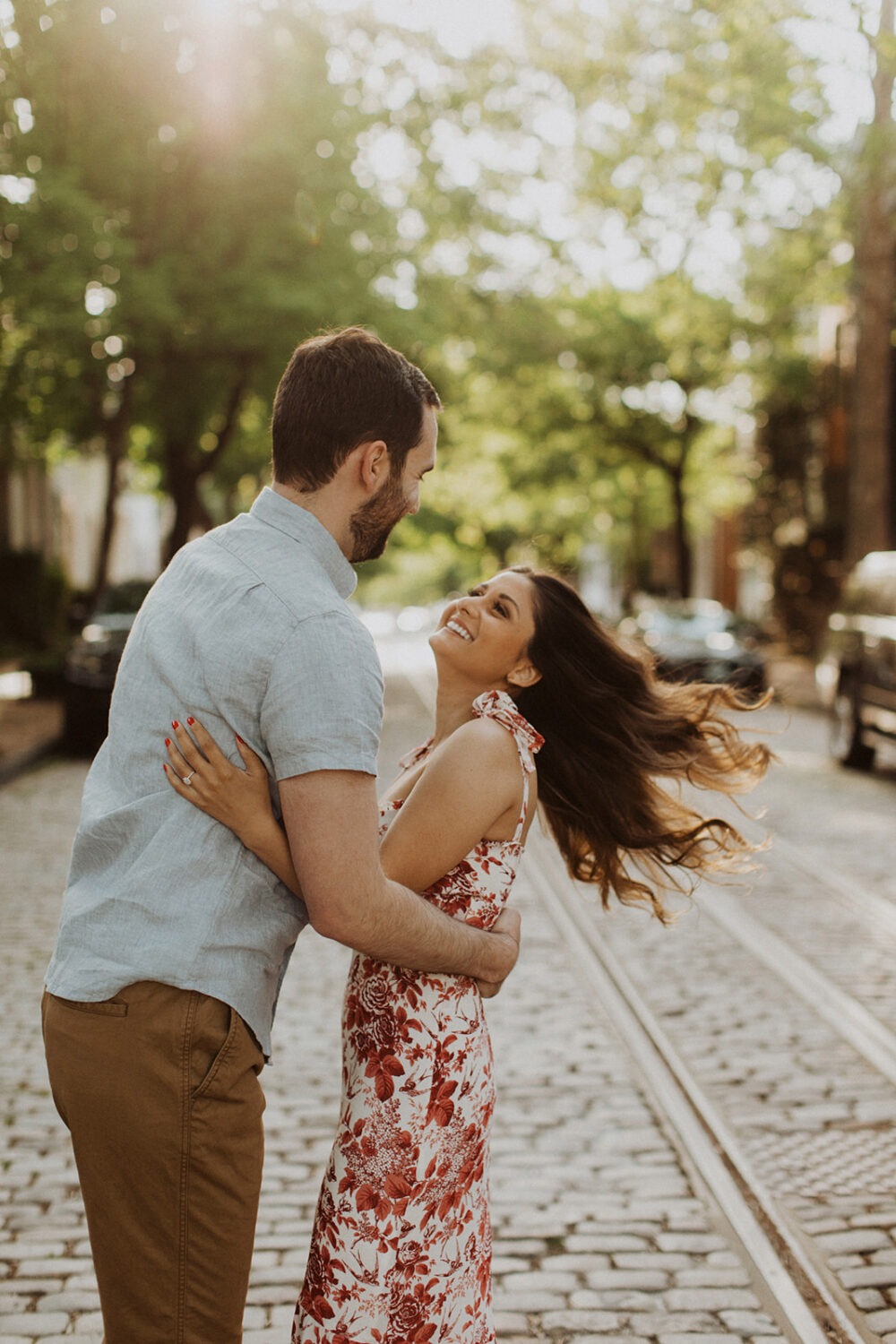 couple embraces at sunset Georgetown engagement shoot photos