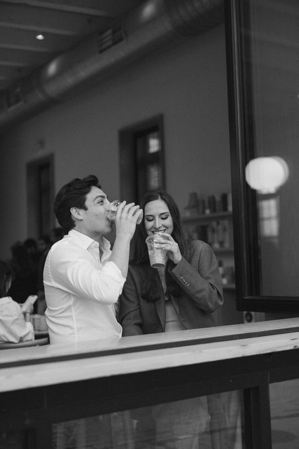 couple drinks coffee at DC engagement session