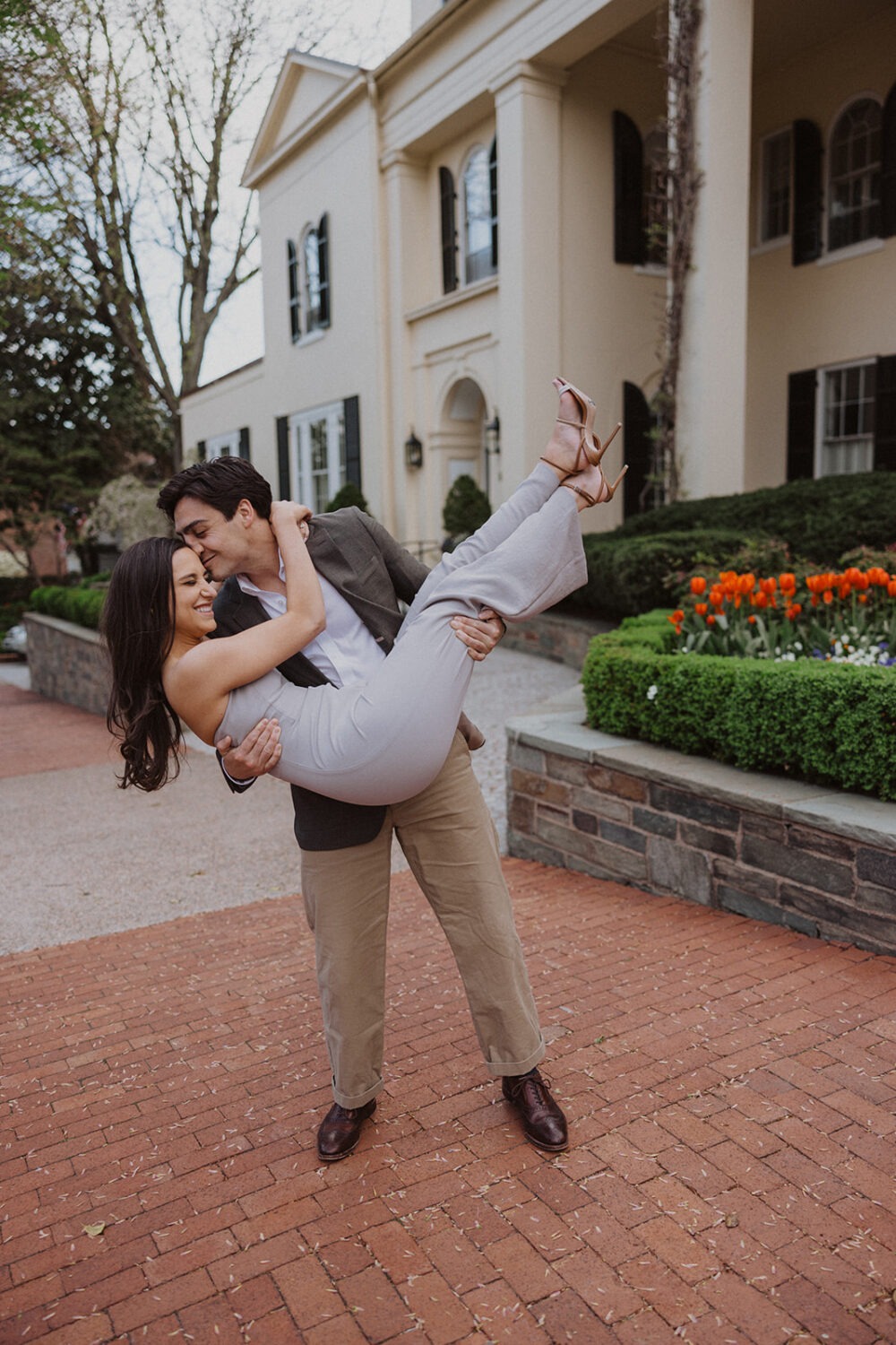 couple kisses during Georgetown engagement shoot photos