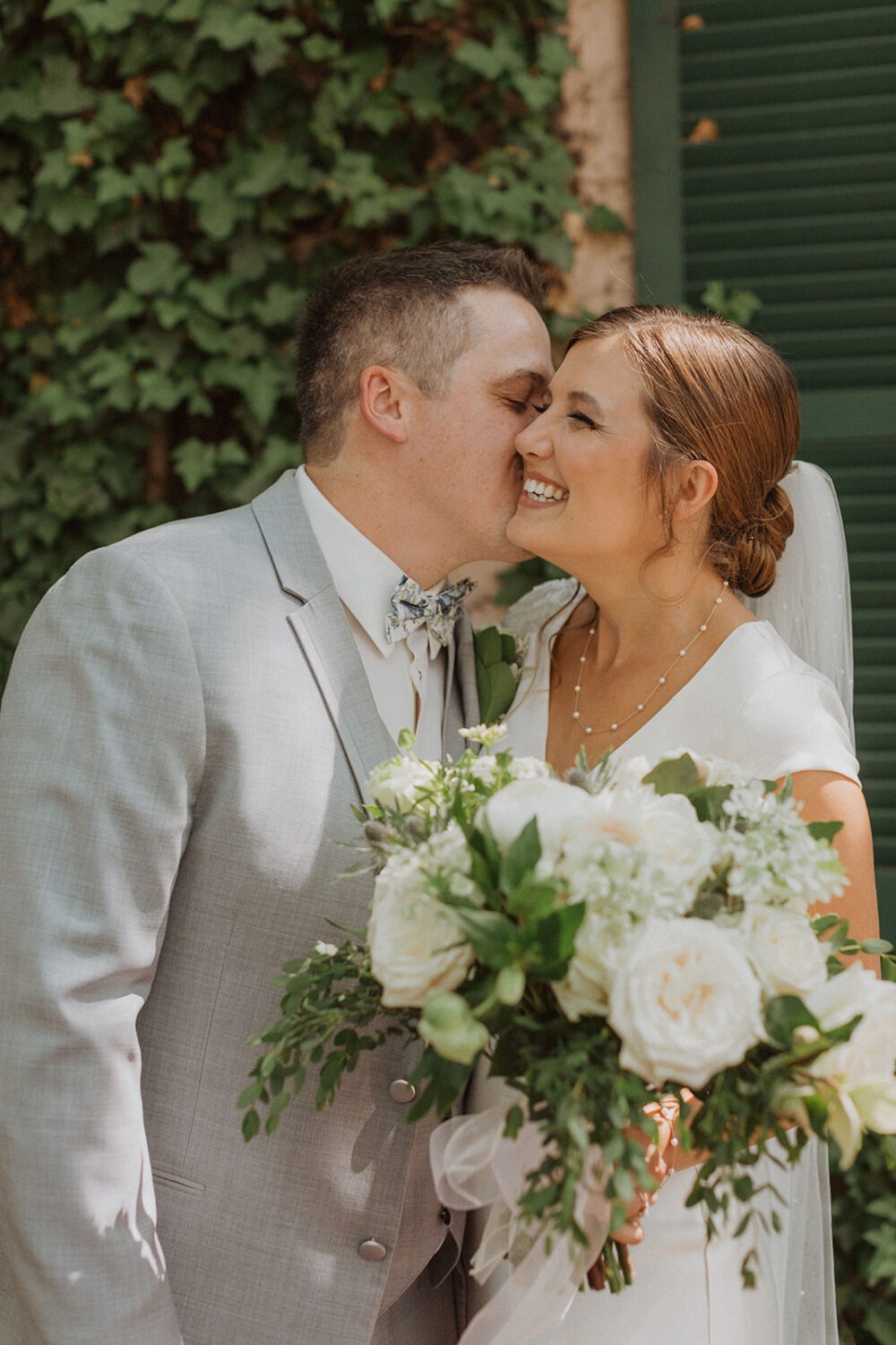 couple kisses at DC wedding 