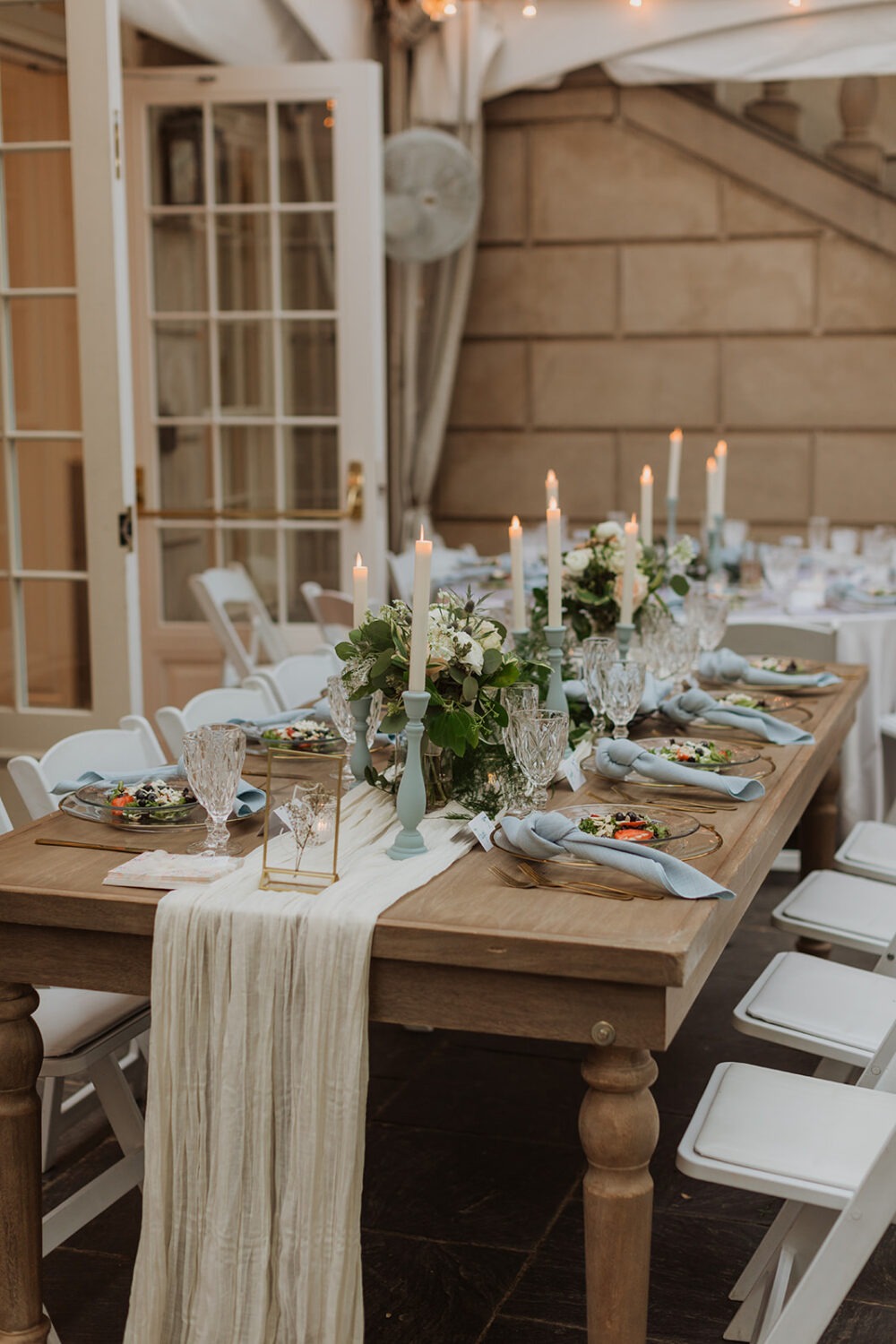 white candles and blue candlesticks wedding decor 