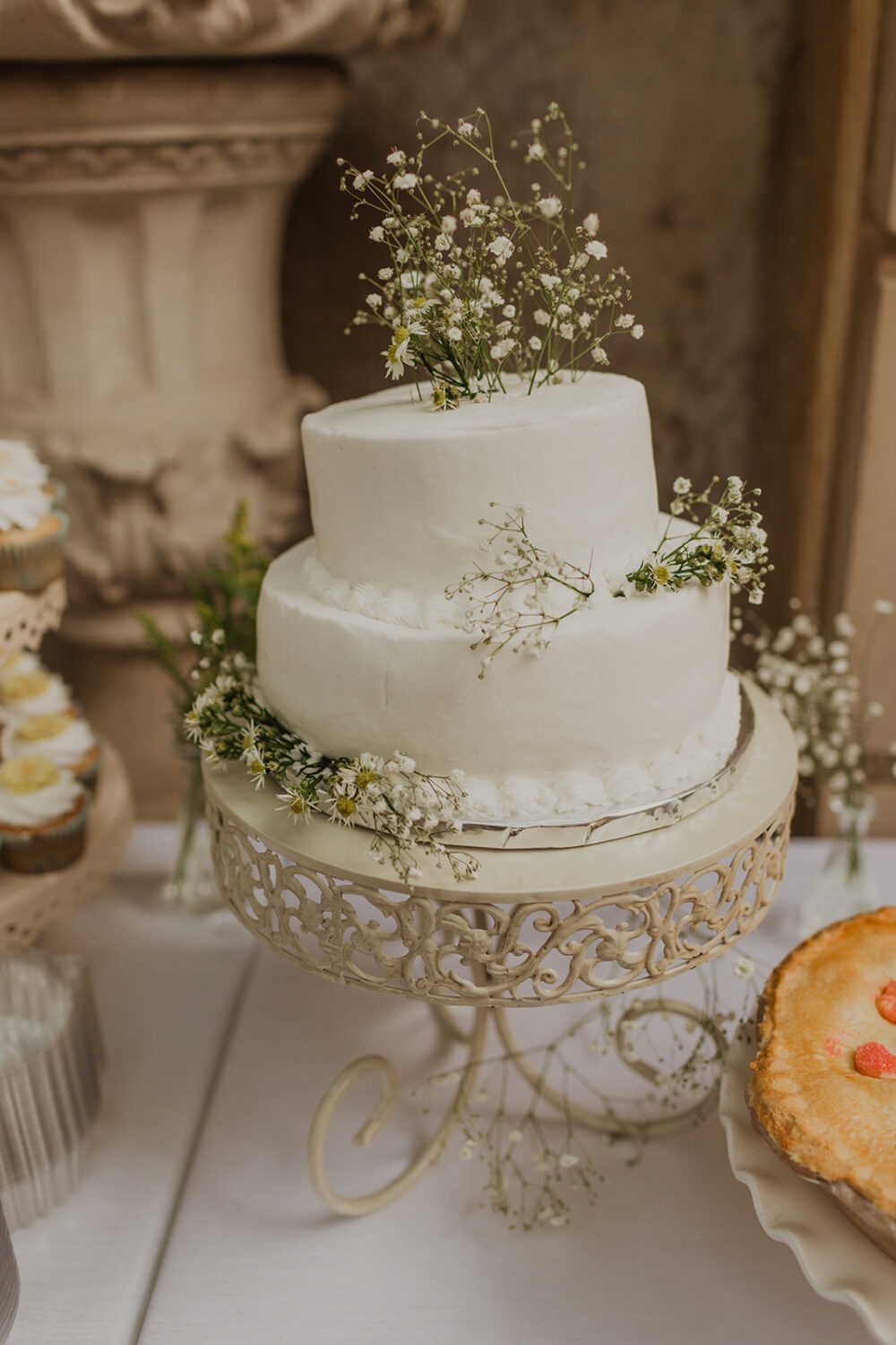 wedding cake with baby's breath created by wedding vendors