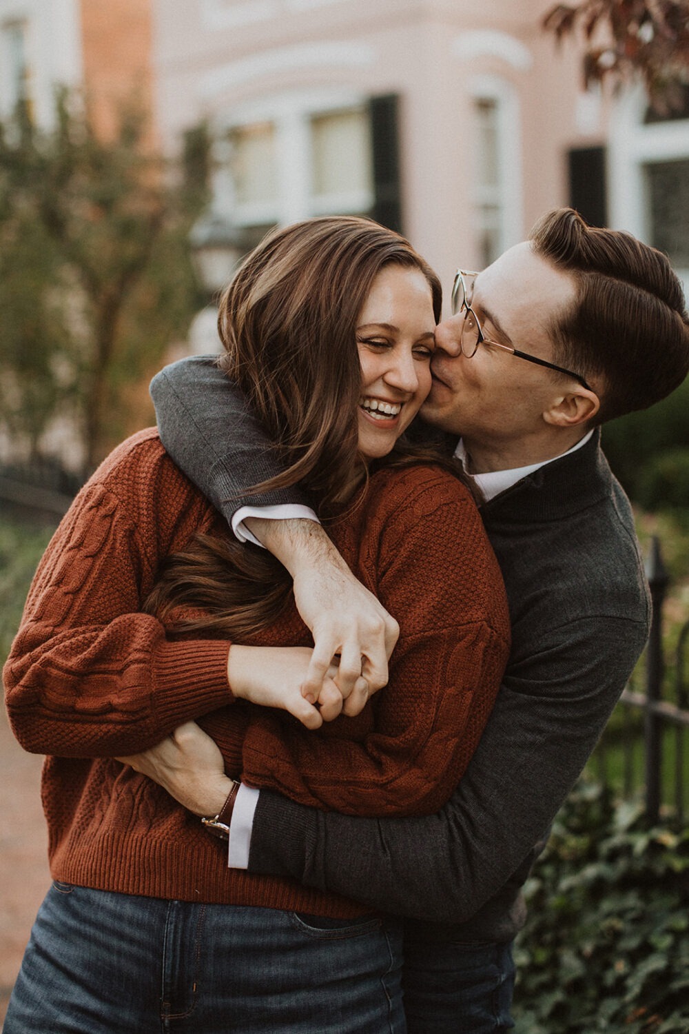 couple kisses at washington DC engagement session
