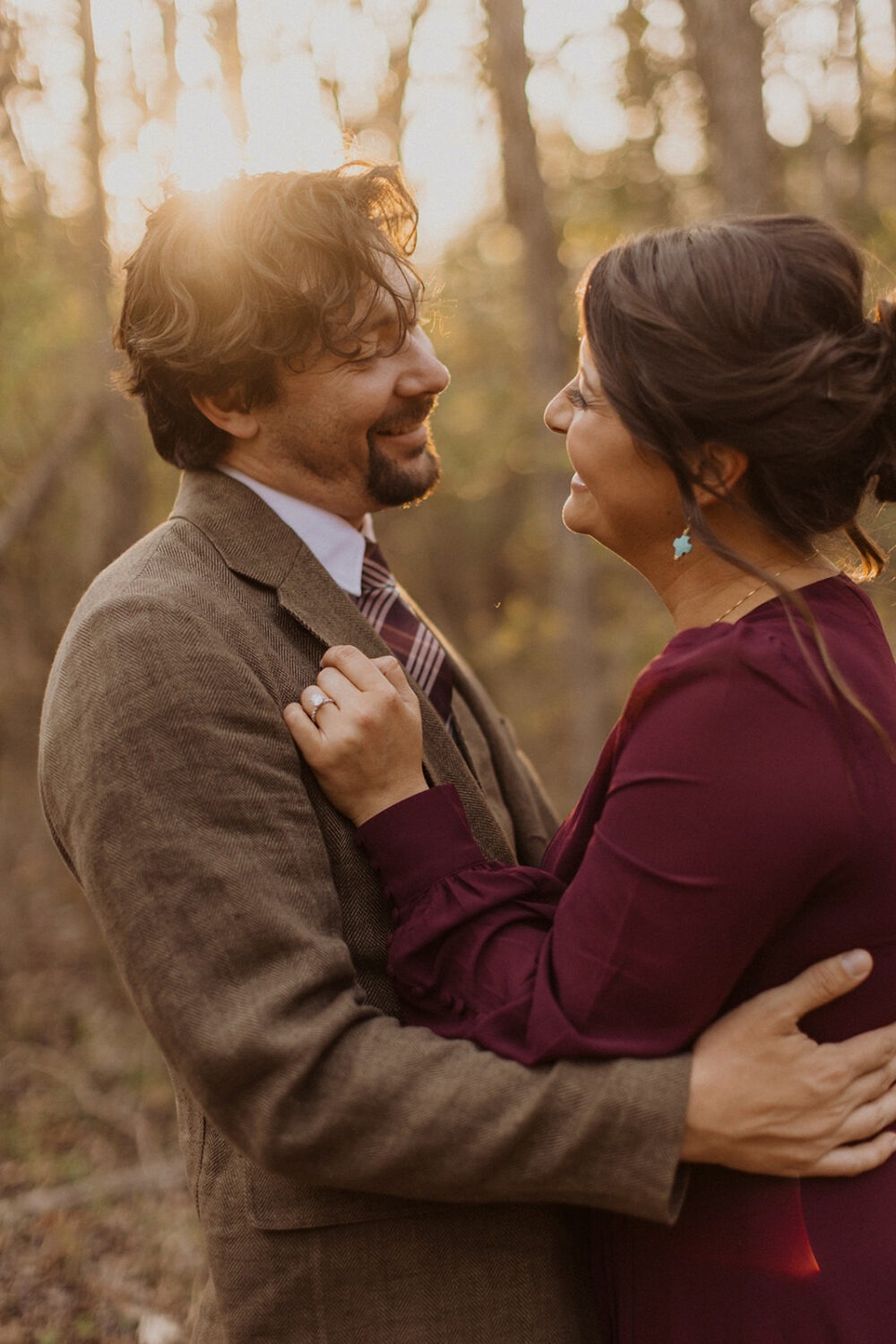 couple embraces at sunset couples shoot