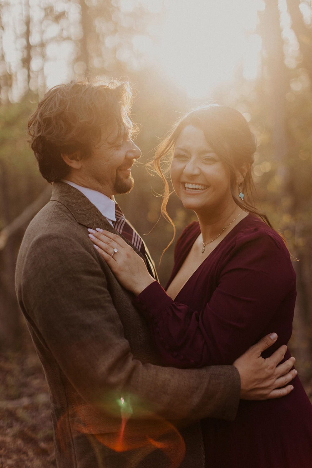 couple embraces at sunset photo shoot