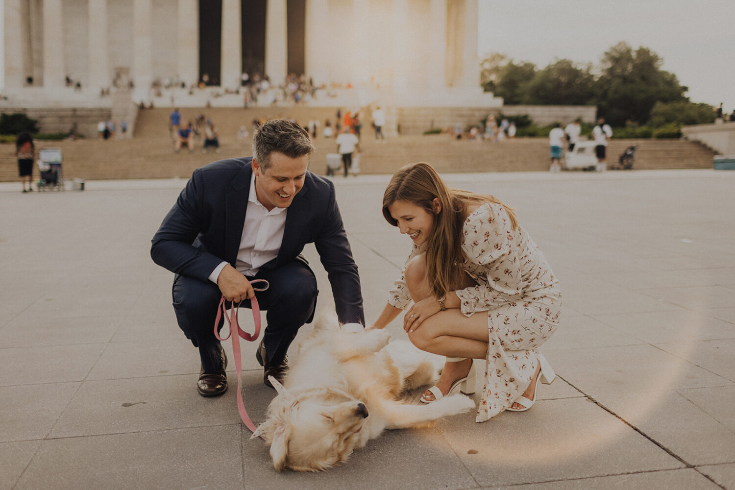 couple pets dog at sunset Lincoln Memorial engagement session