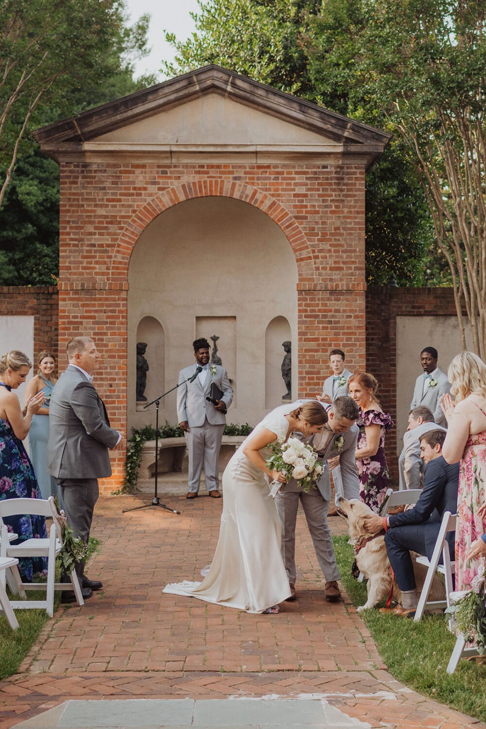 couple pets dog during wedding ceremony at Dumbarton House wedding