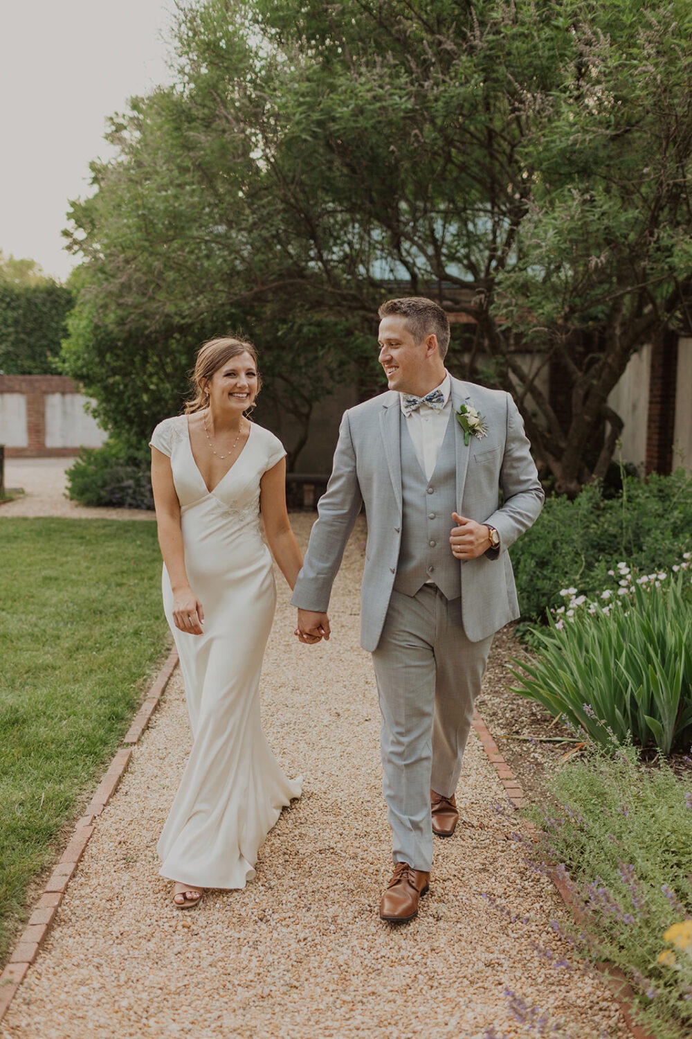 couple walks along garden at Dumbarton House wedding