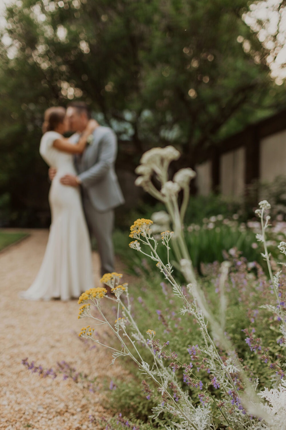 couple kisses in garden at Dumbarton House wedding