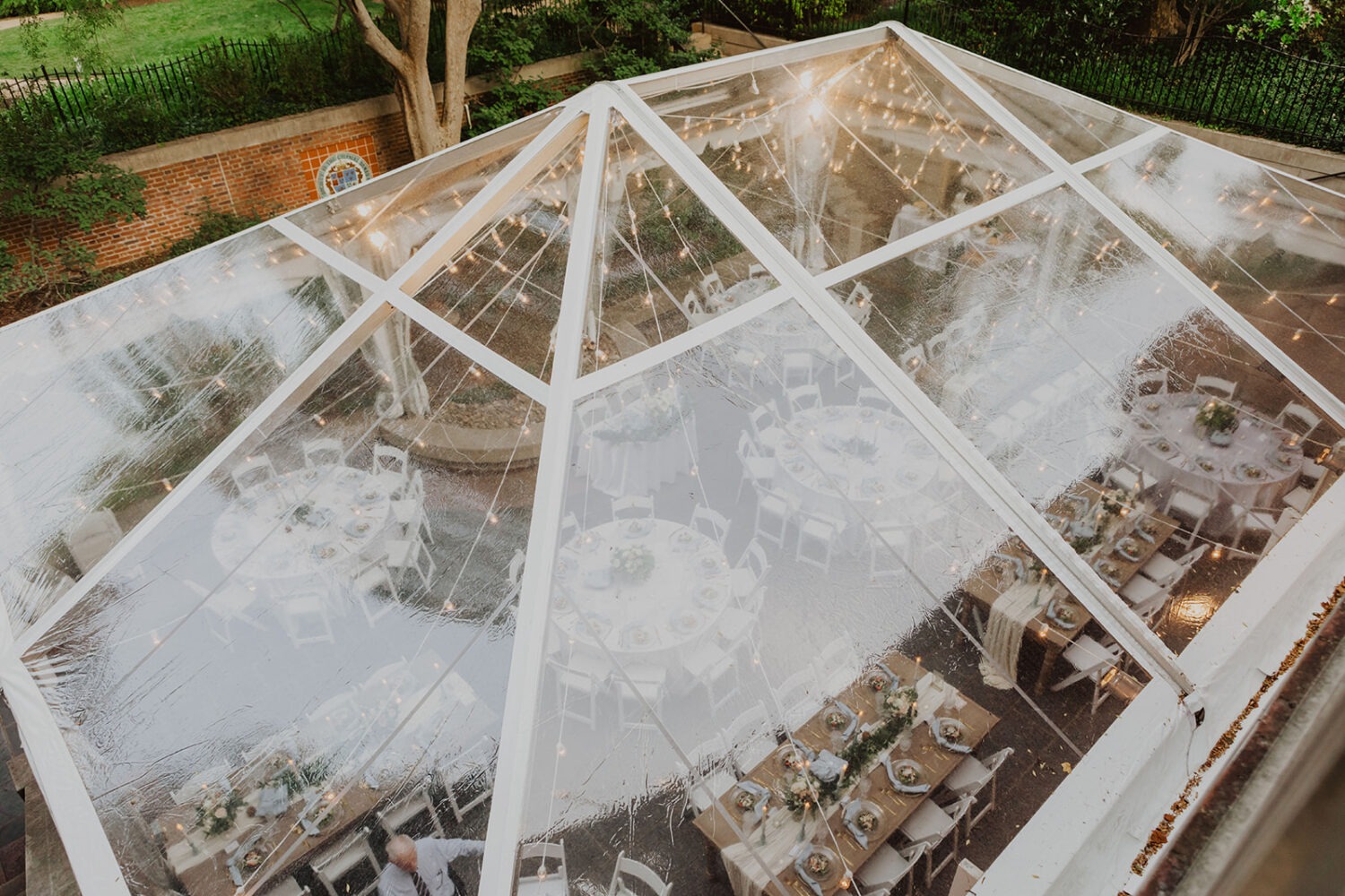 blue and gold table settings at tent garden wedding