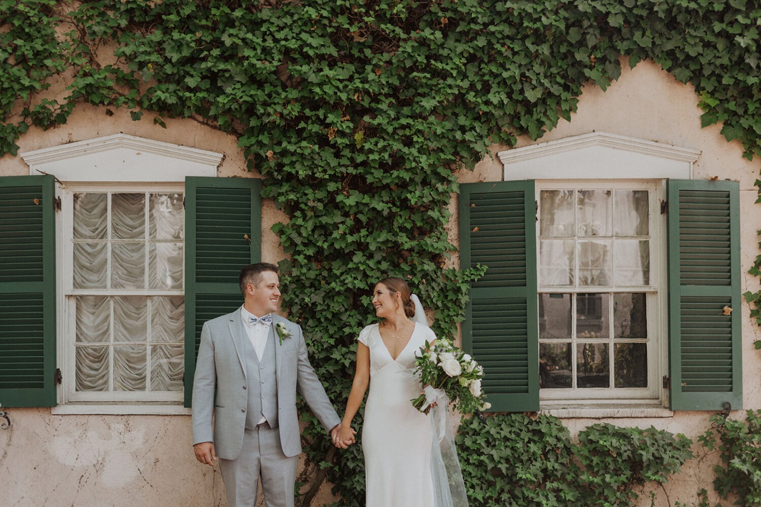 couple holds hands at Georgetown Washington DC wedding