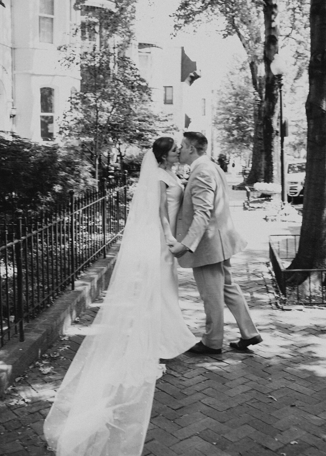 couple kisses at Georgetown Washington DC wedding 