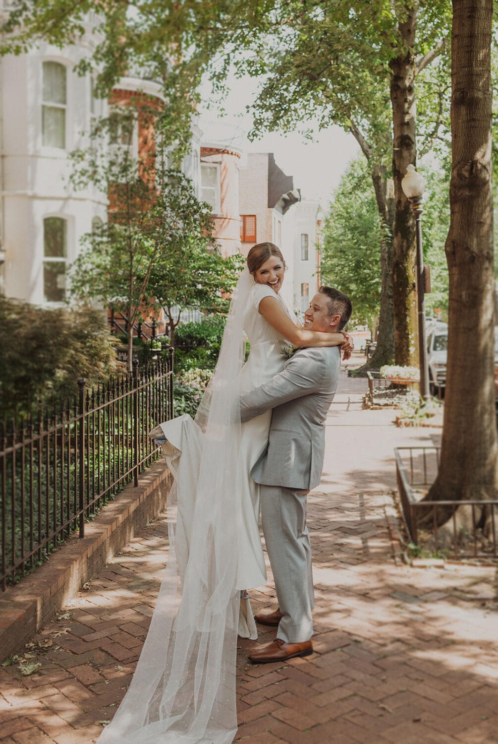 couple embraces at Georgetown Washington DC wedding 