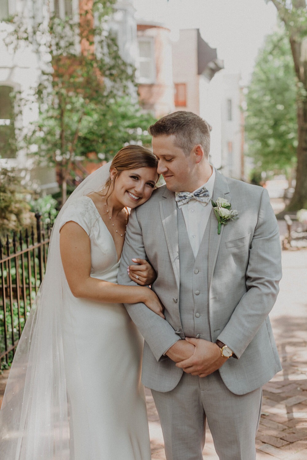 couple embraces at Georgetown Washington DC wedding 