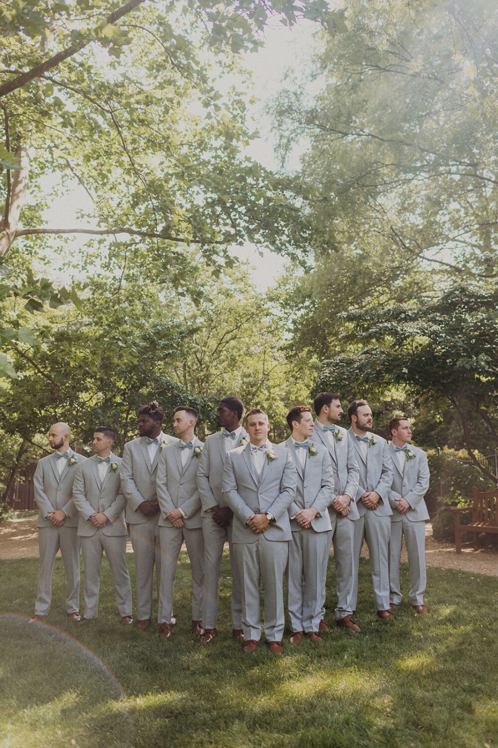 groom poses with groomsmen at Dumbarton House wedding