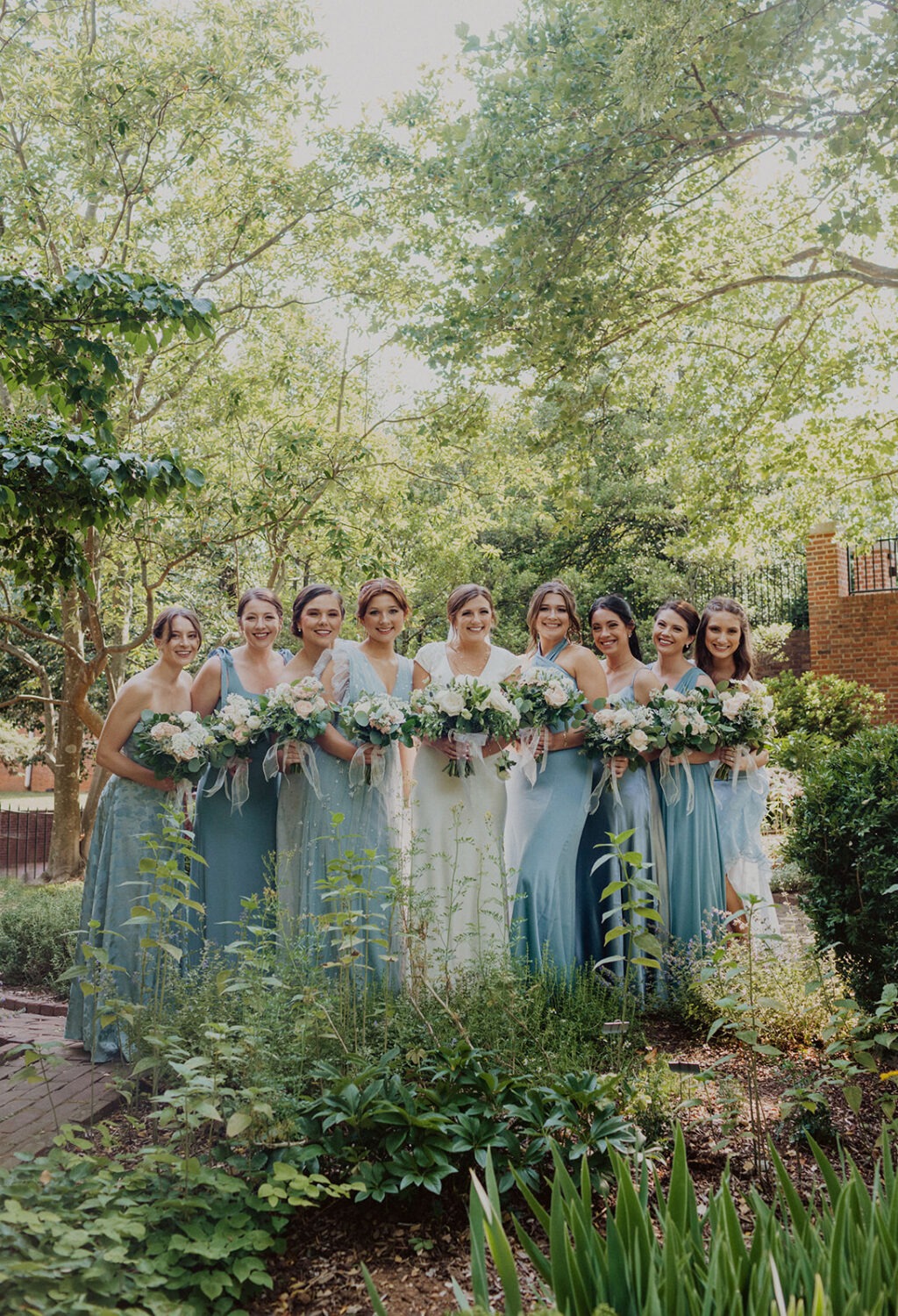 bride poses with bridesmaids at Dumbarton House wedding