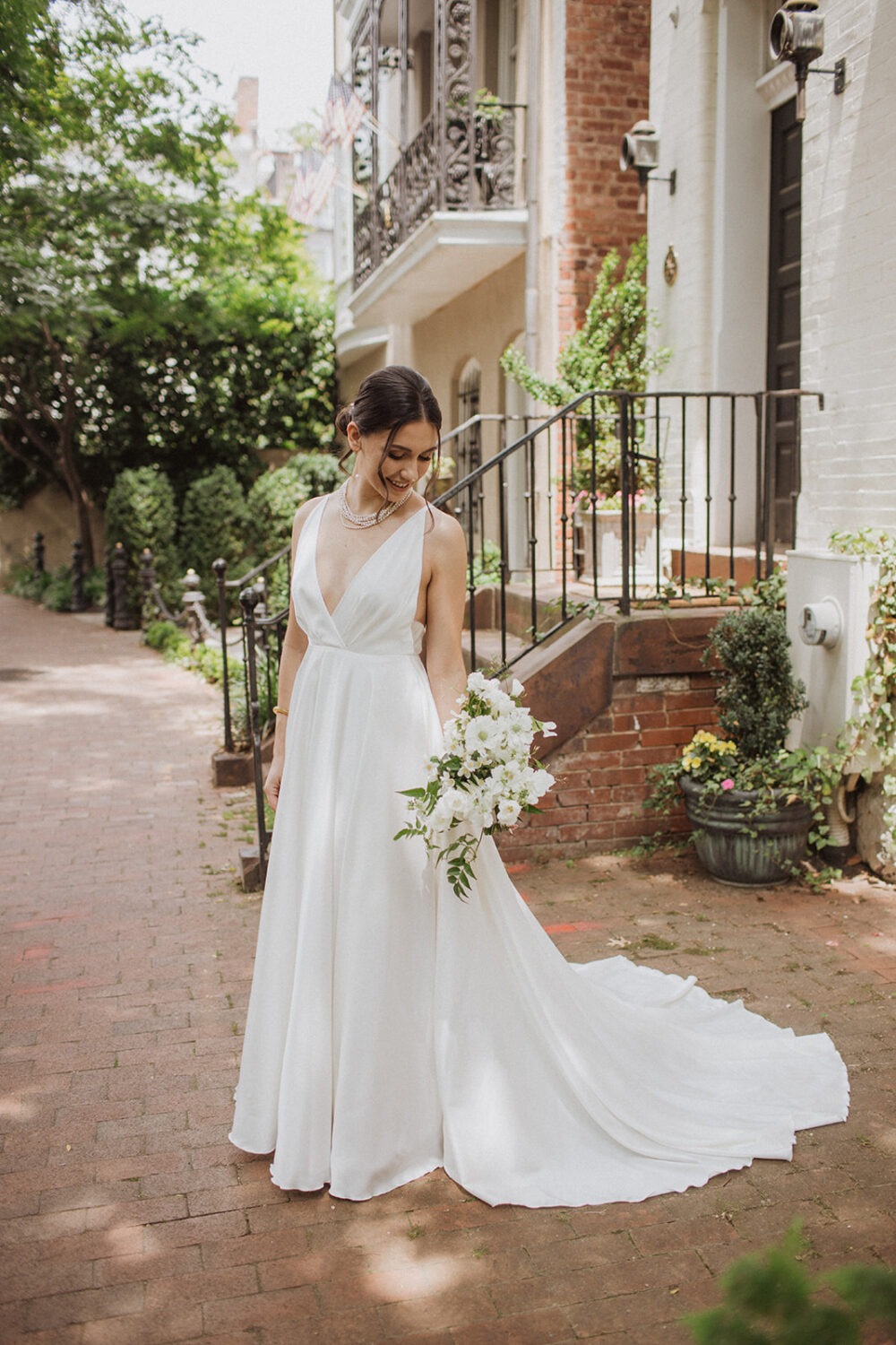 bride holds white wedding bouquet during wedding bridals