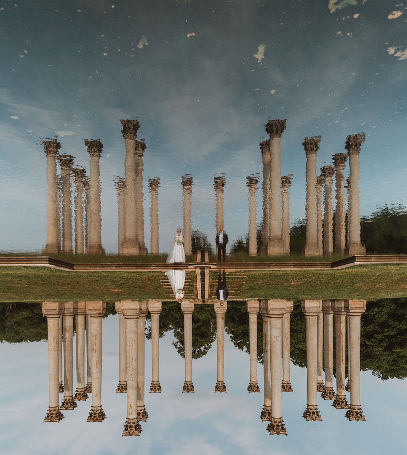 couple poses under Capitol Columns at National Arboretum DC wedding