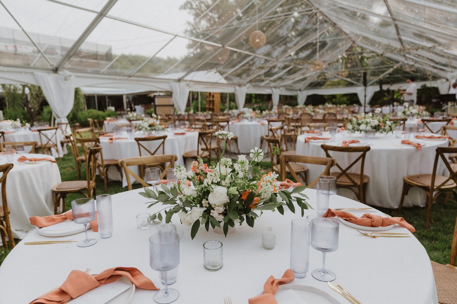 table settings at outdoor wedding with tent 