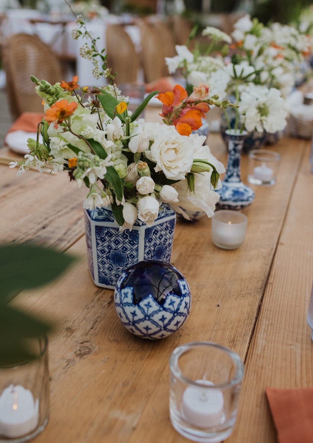 white and blue porcelain wedding decor at outdoor wedding with tent