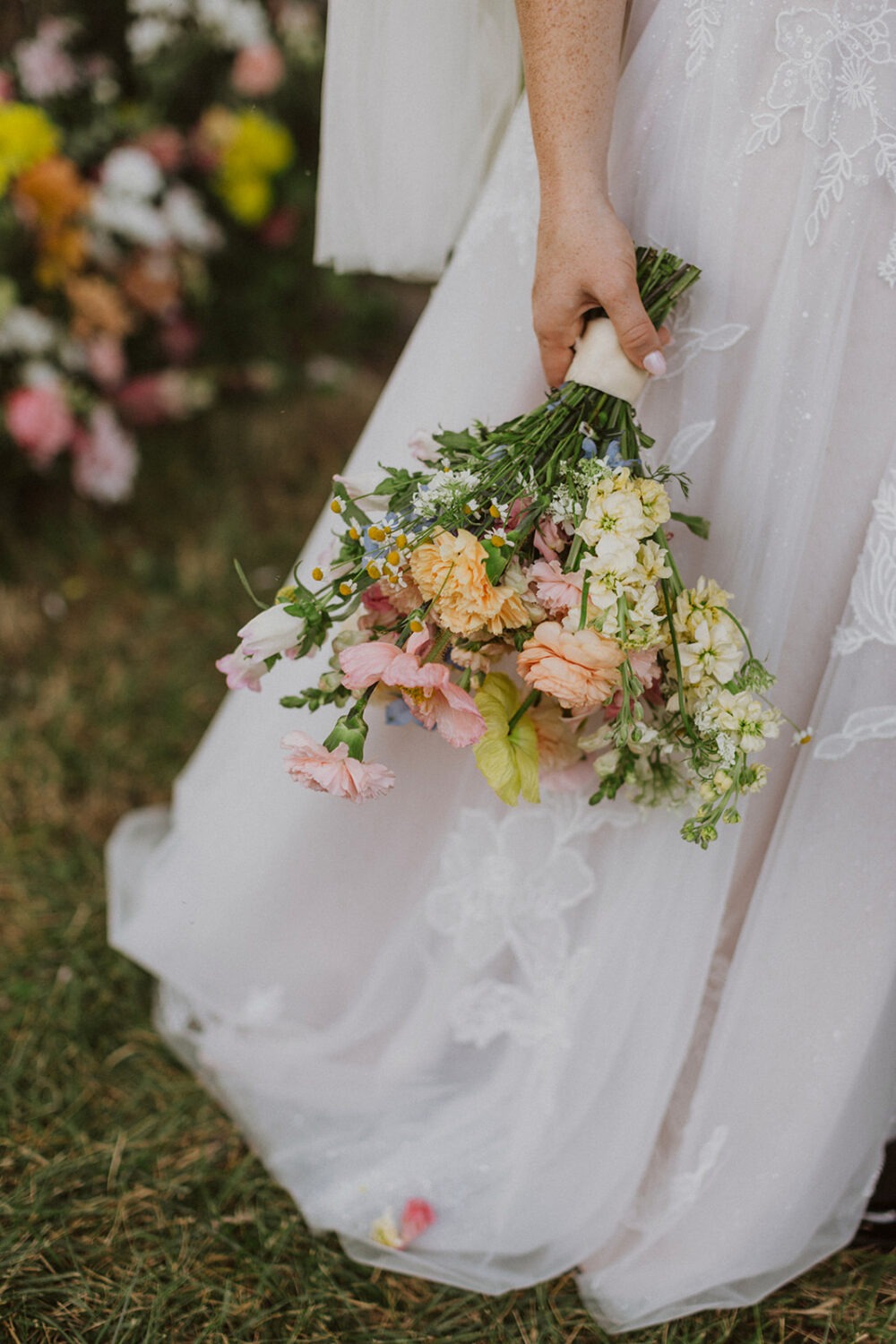 bride holds bouquet from wedding florist ideas