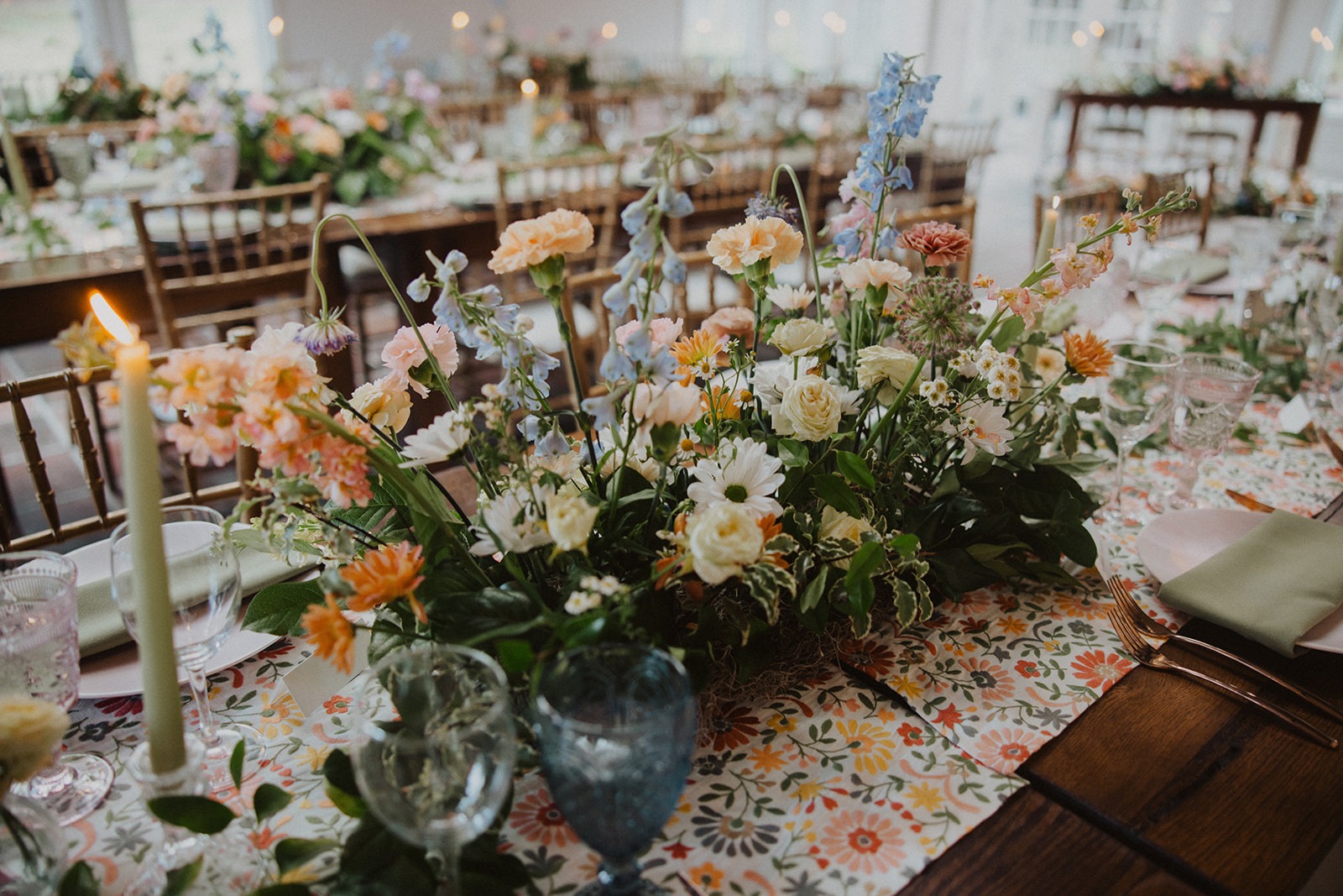 florals and greenery on reception table setting