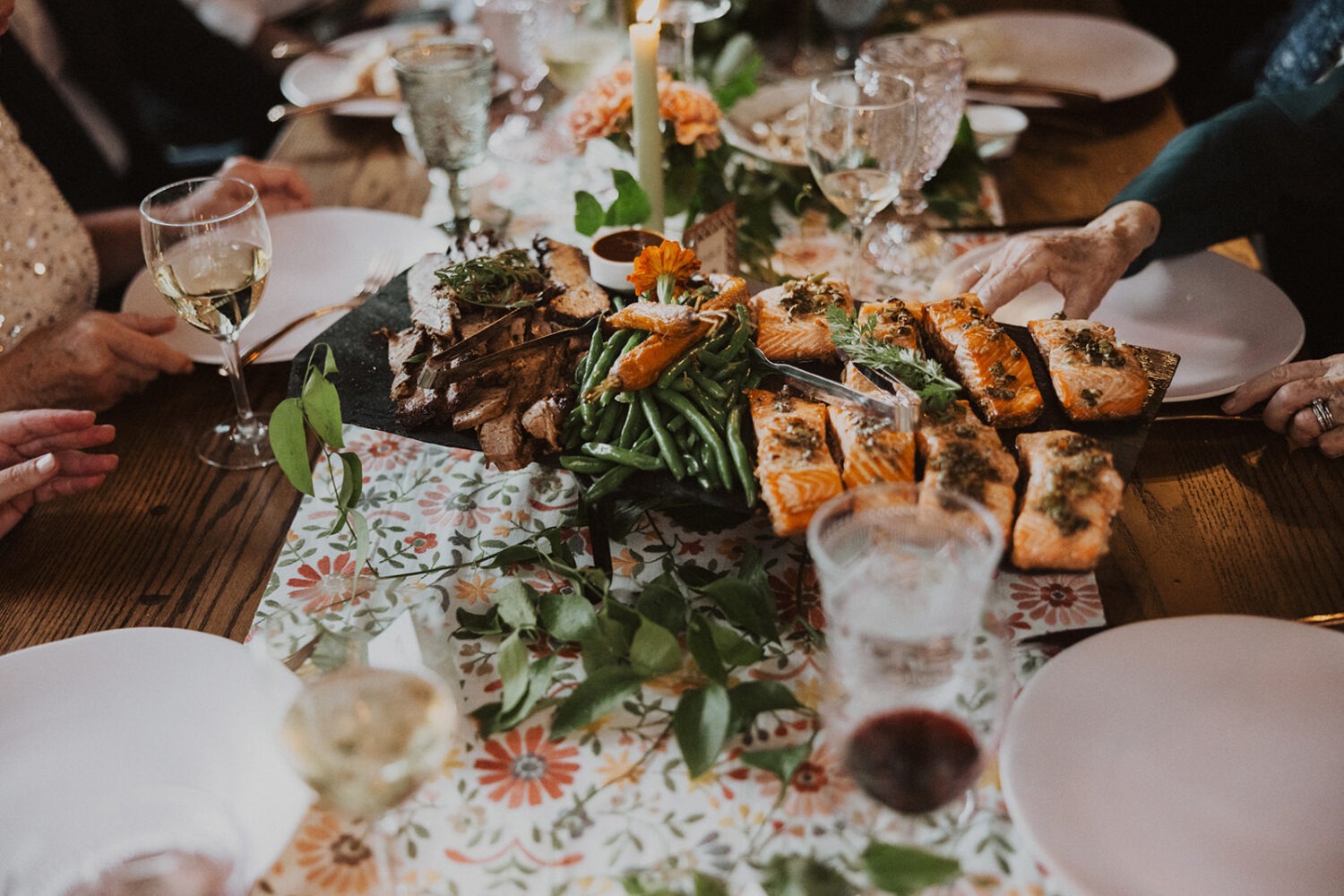 wedding reception meal on table with guests