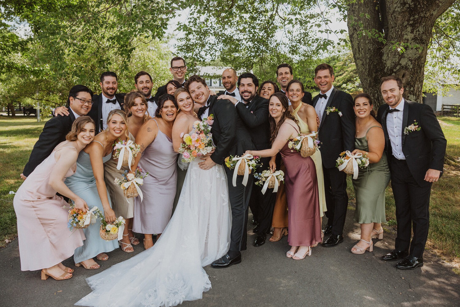 couple poses with wedding party