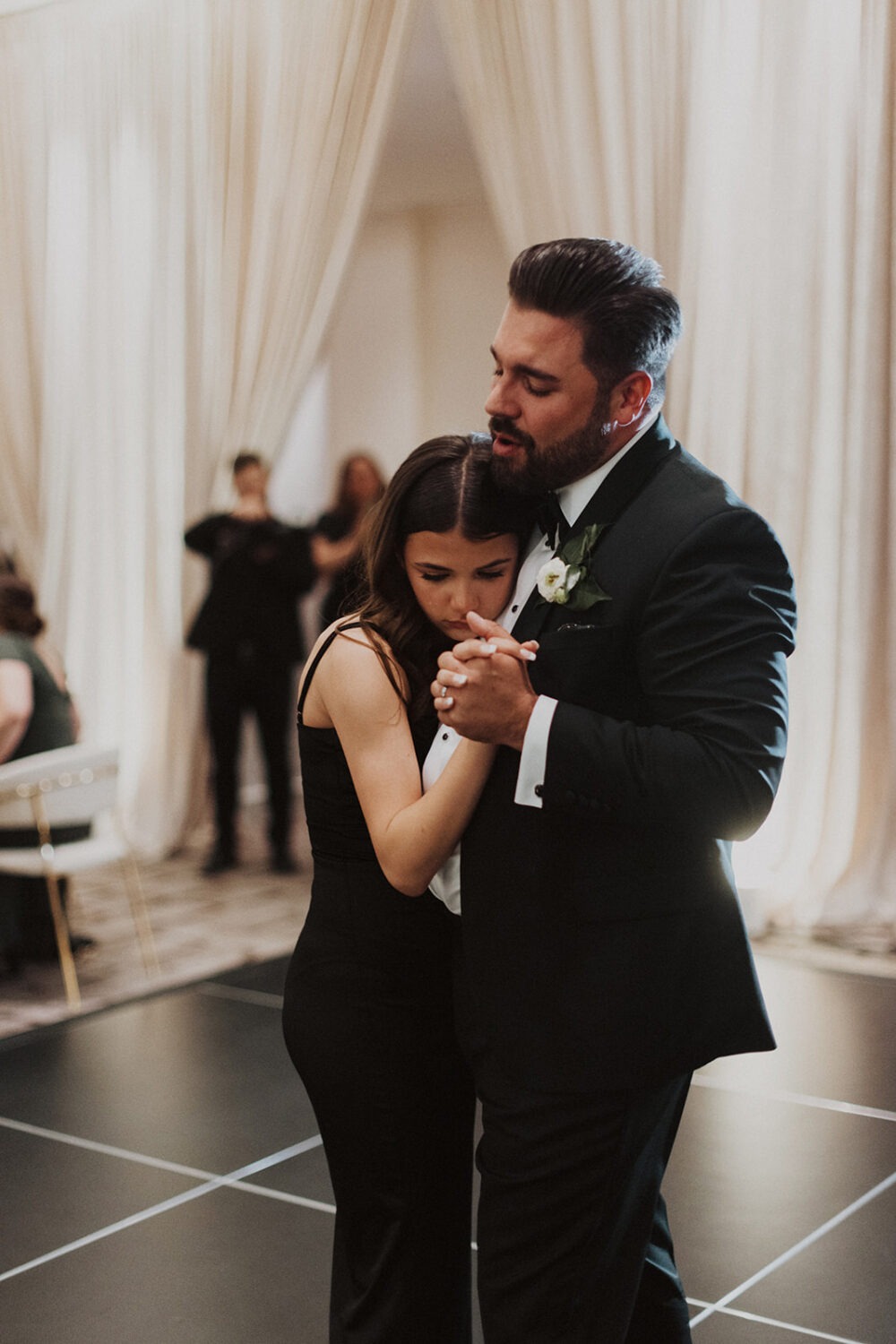 father and daughter dance during wedding reception