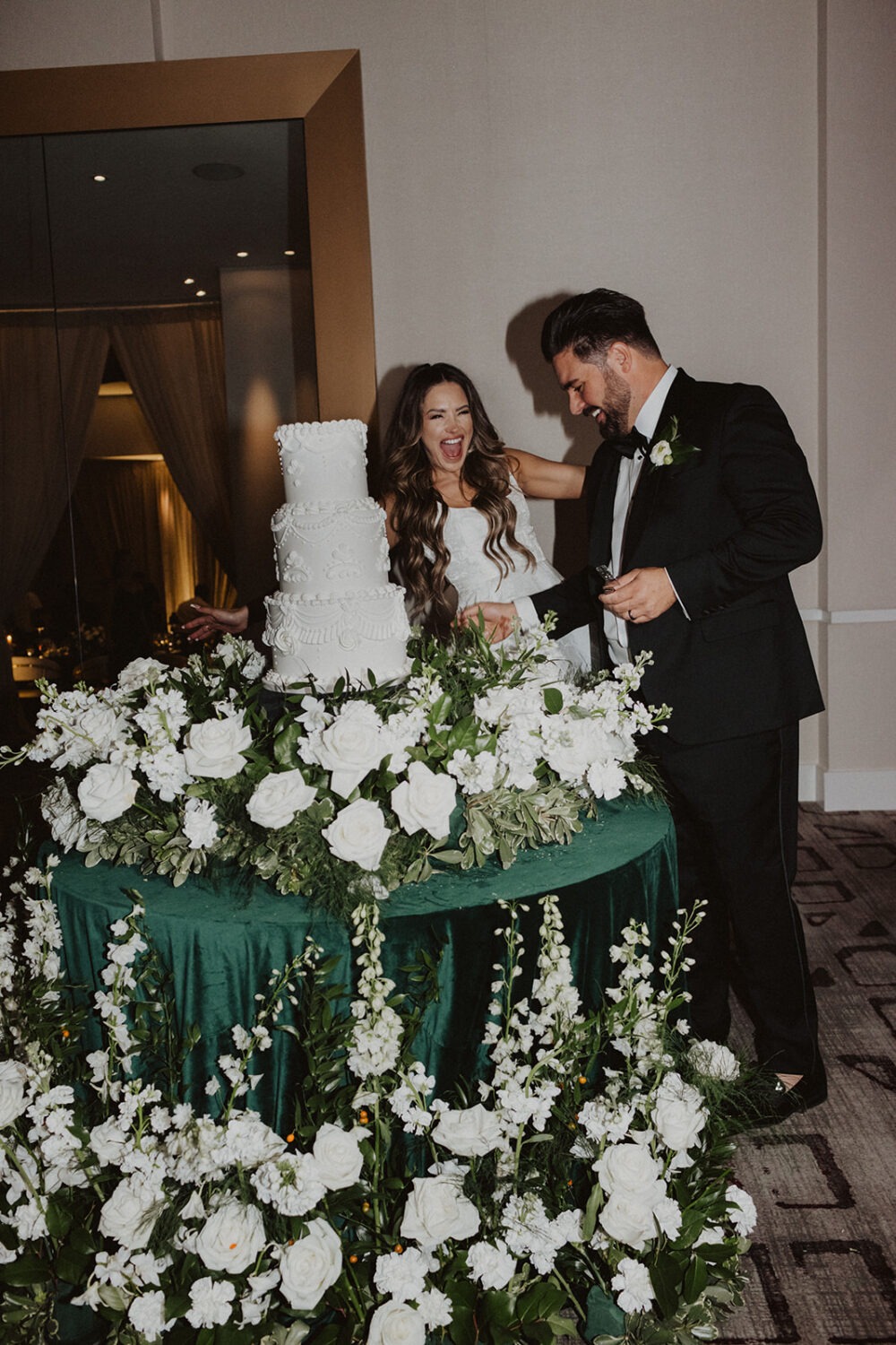 couple eats cake during wedding reception