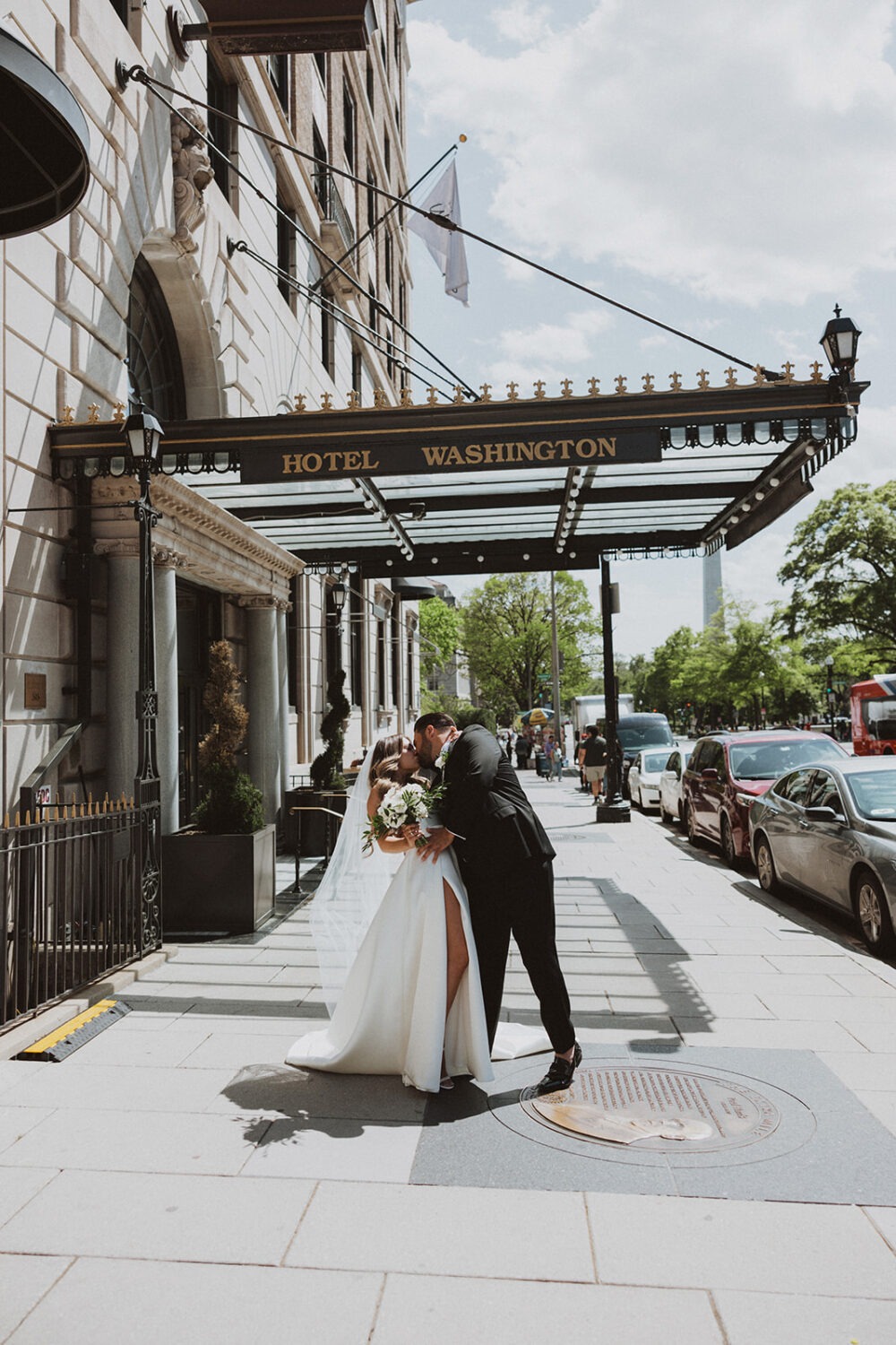 couple kisses at Hotel Washington for wedding photo shoot ideas