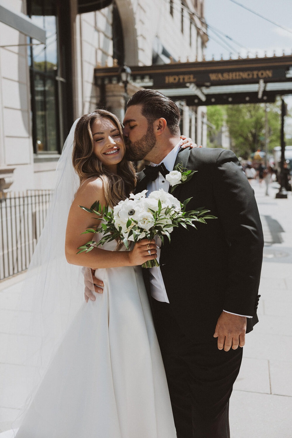 couple kisses posing for wedding photo shoot ideas