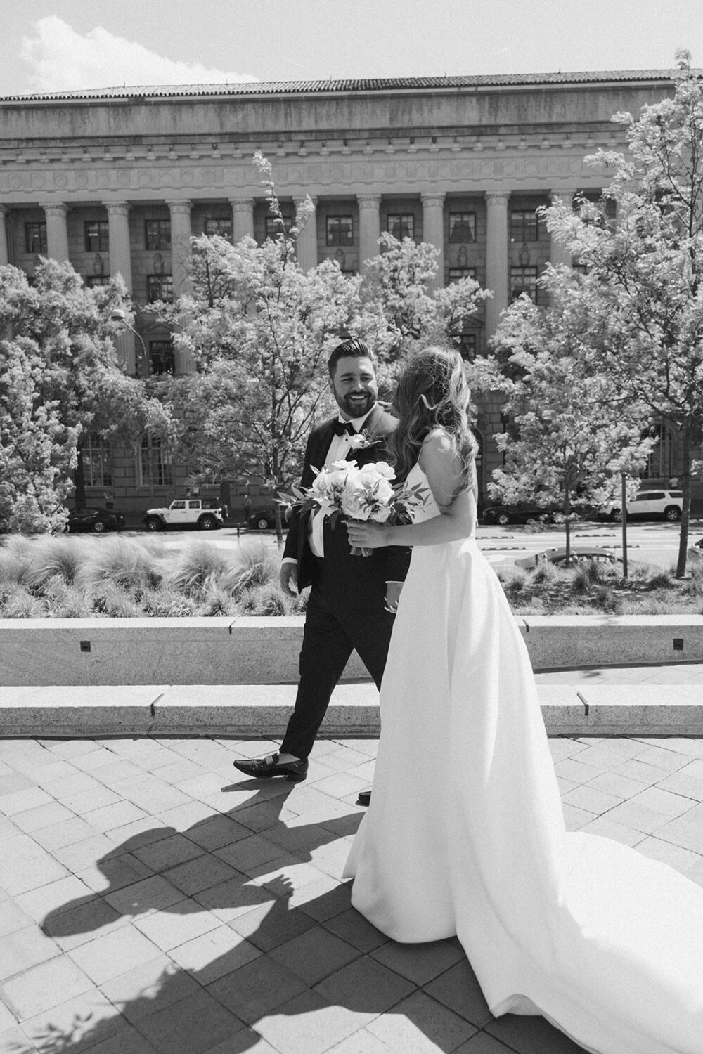 couple walks holding hands for wedding photo shoot ideas