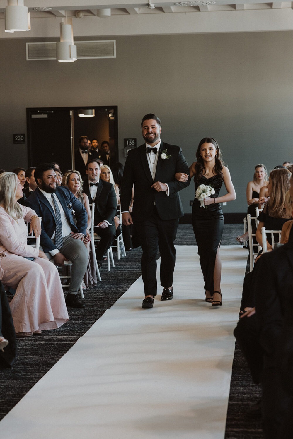 daughter walks groom down wedding aisle 