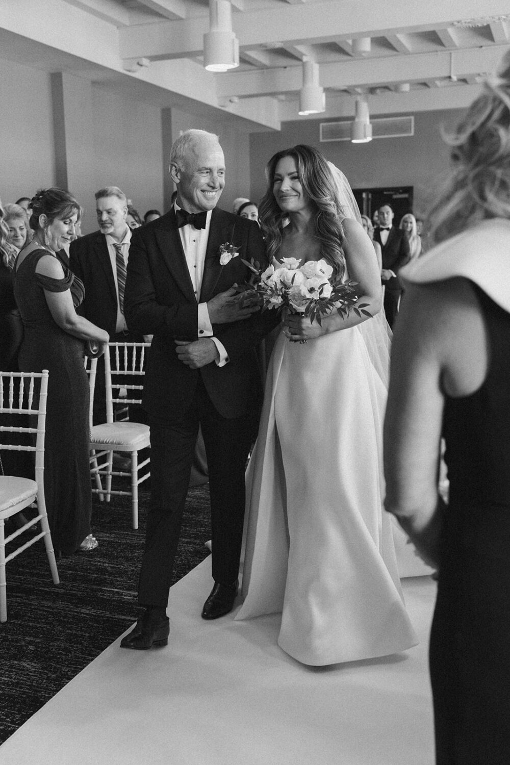 bride walks during aisle at Hotel Washington wedding 