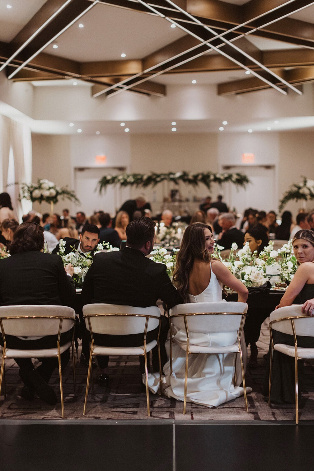 couple sits at wedding reception table at Hotel Washington wedding 