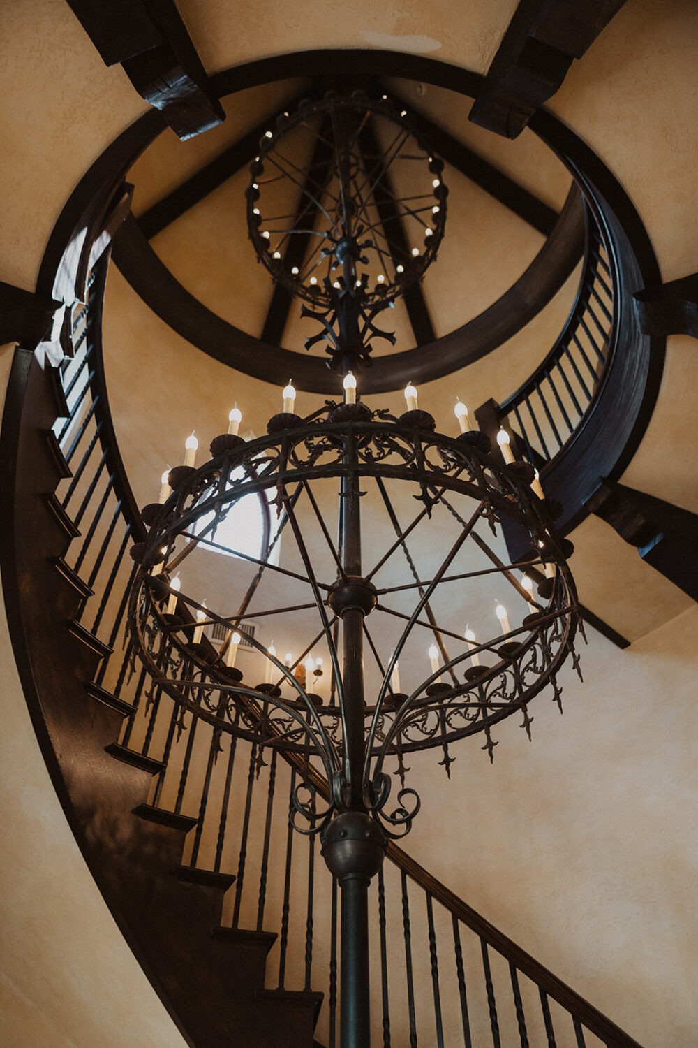 spiral staircase and candlelit chandeliers at historic Virginia estate