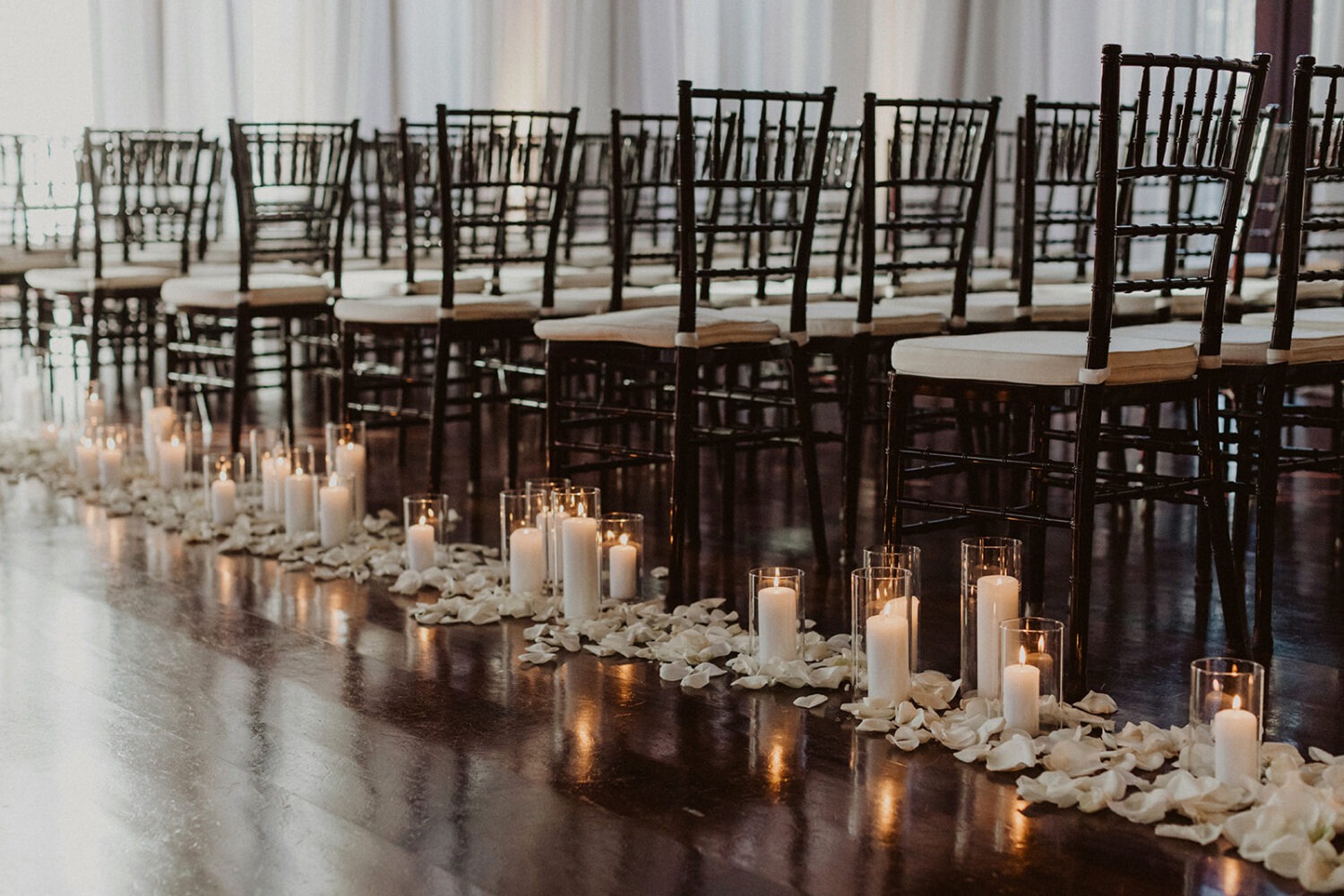 white candles and petals at Dover Hall Virginia wedding venue