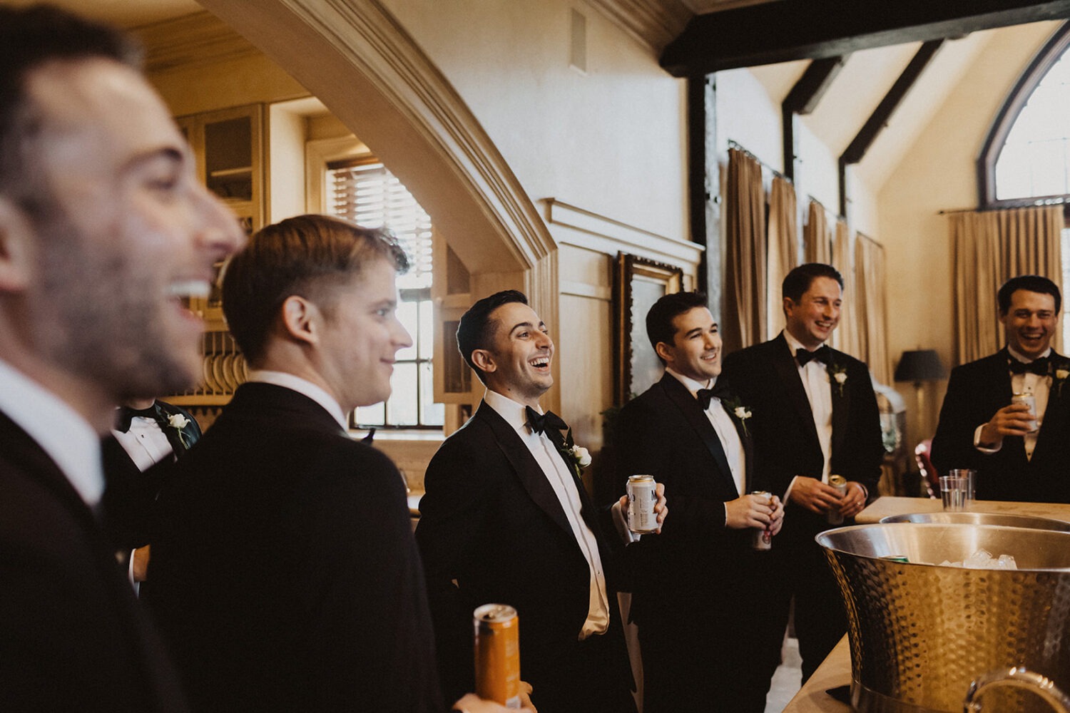 groom laughs with groomsmen at Dover Hall Virginia wedding venue