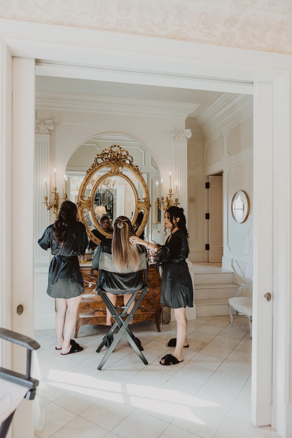 bridesmaids in black silk robes during wedding getting ready