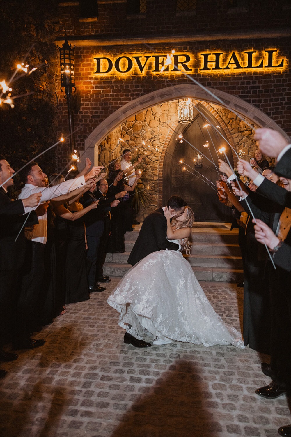 couple exits under sparklers at Dover Hall Virginia wedding venue