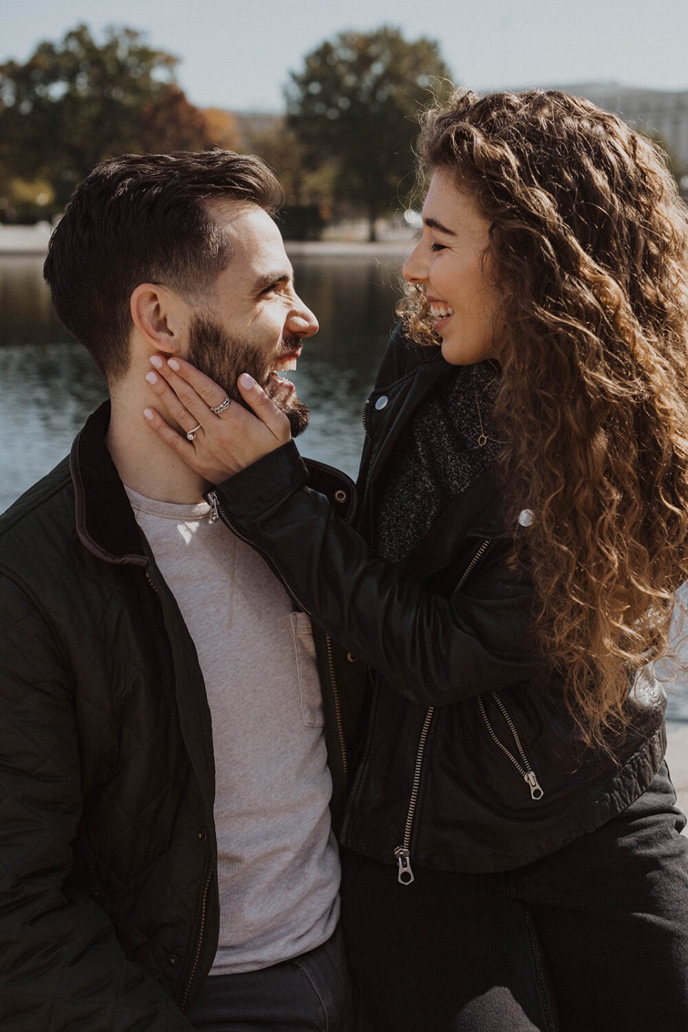 couple embraces at Washingtion DC outdoor engagement session