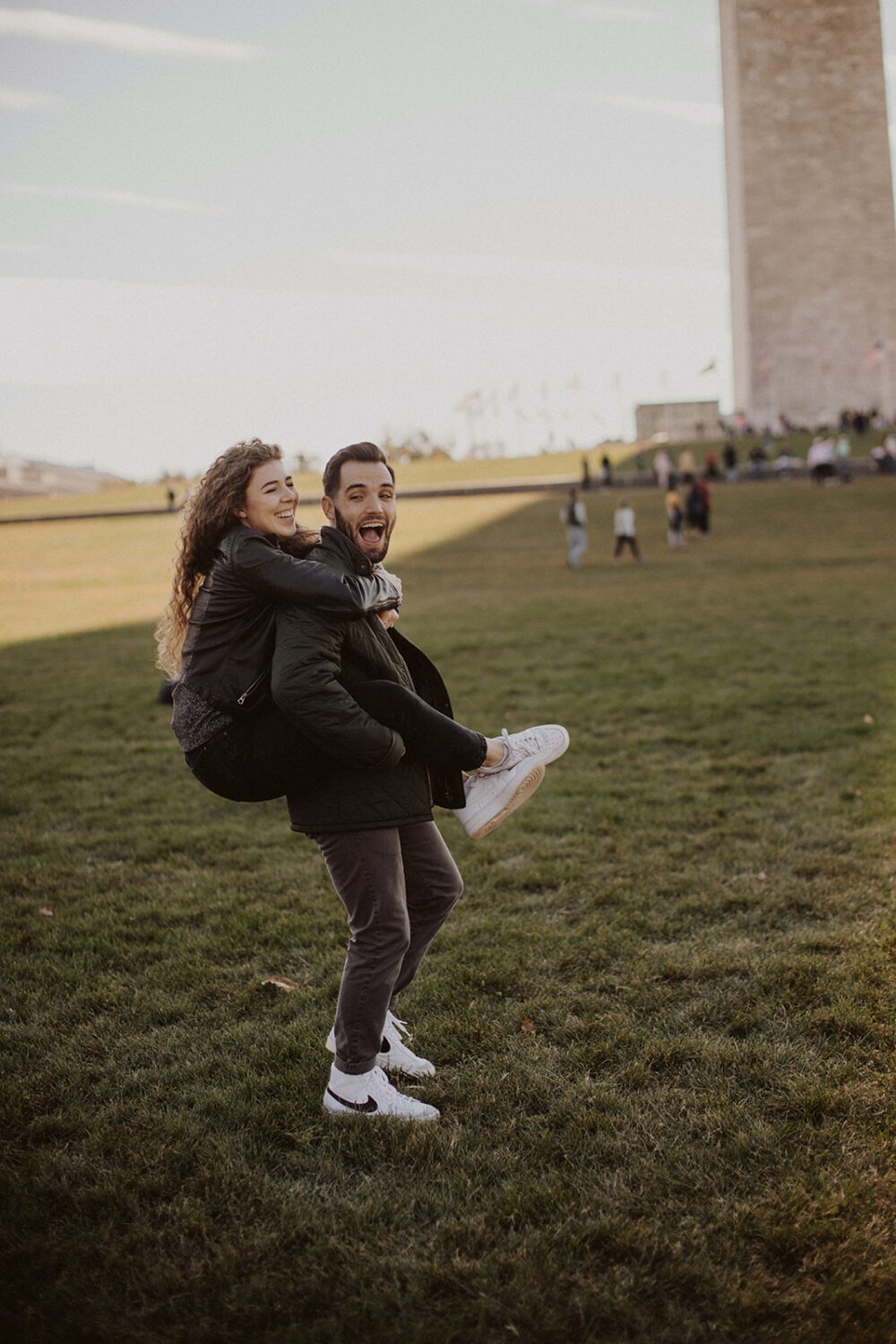 couple embraces at Washingtion DC outdoor engagement session